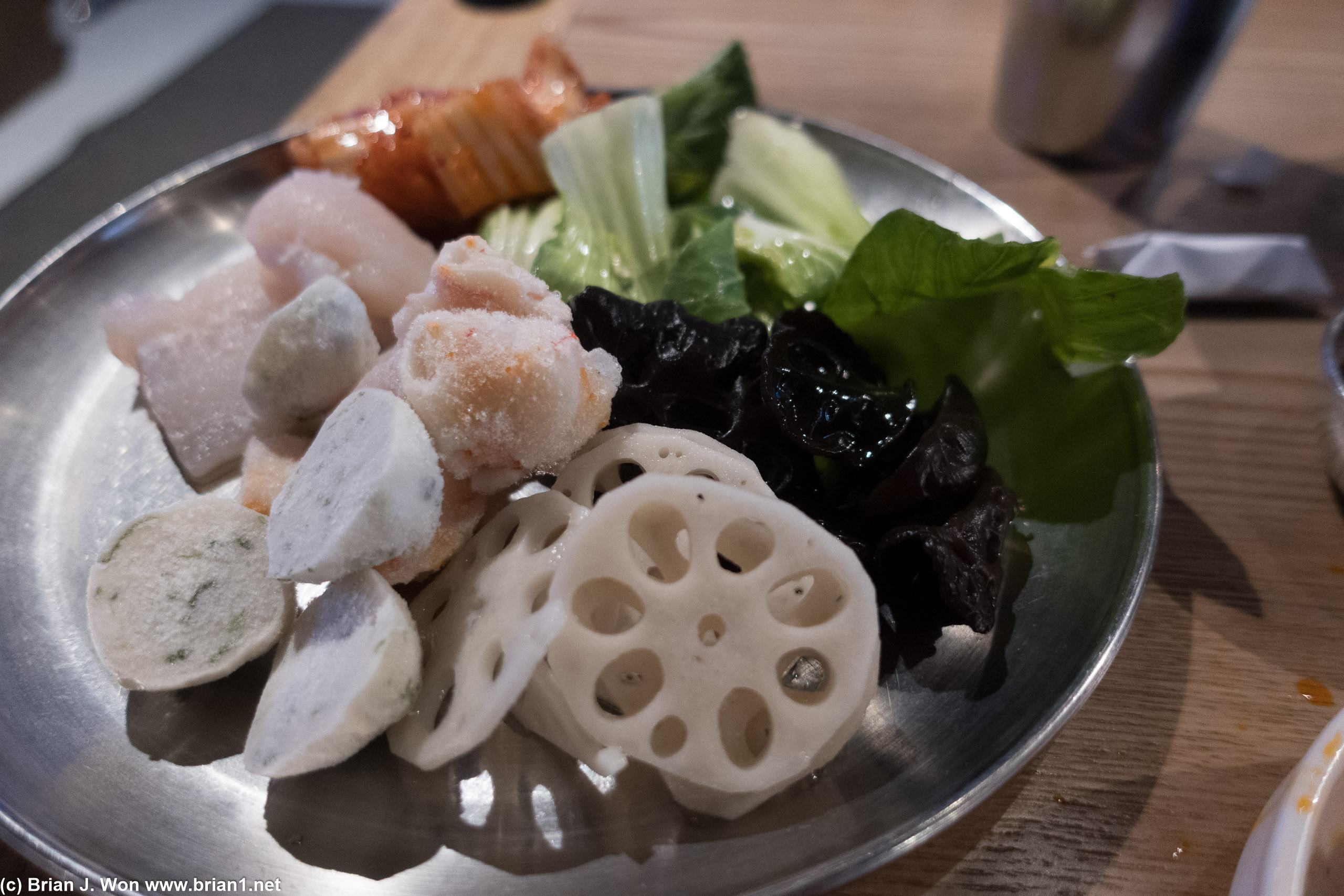 Fish balls, lobster balls, black fungus, lotus root, bok choy, kim chi.