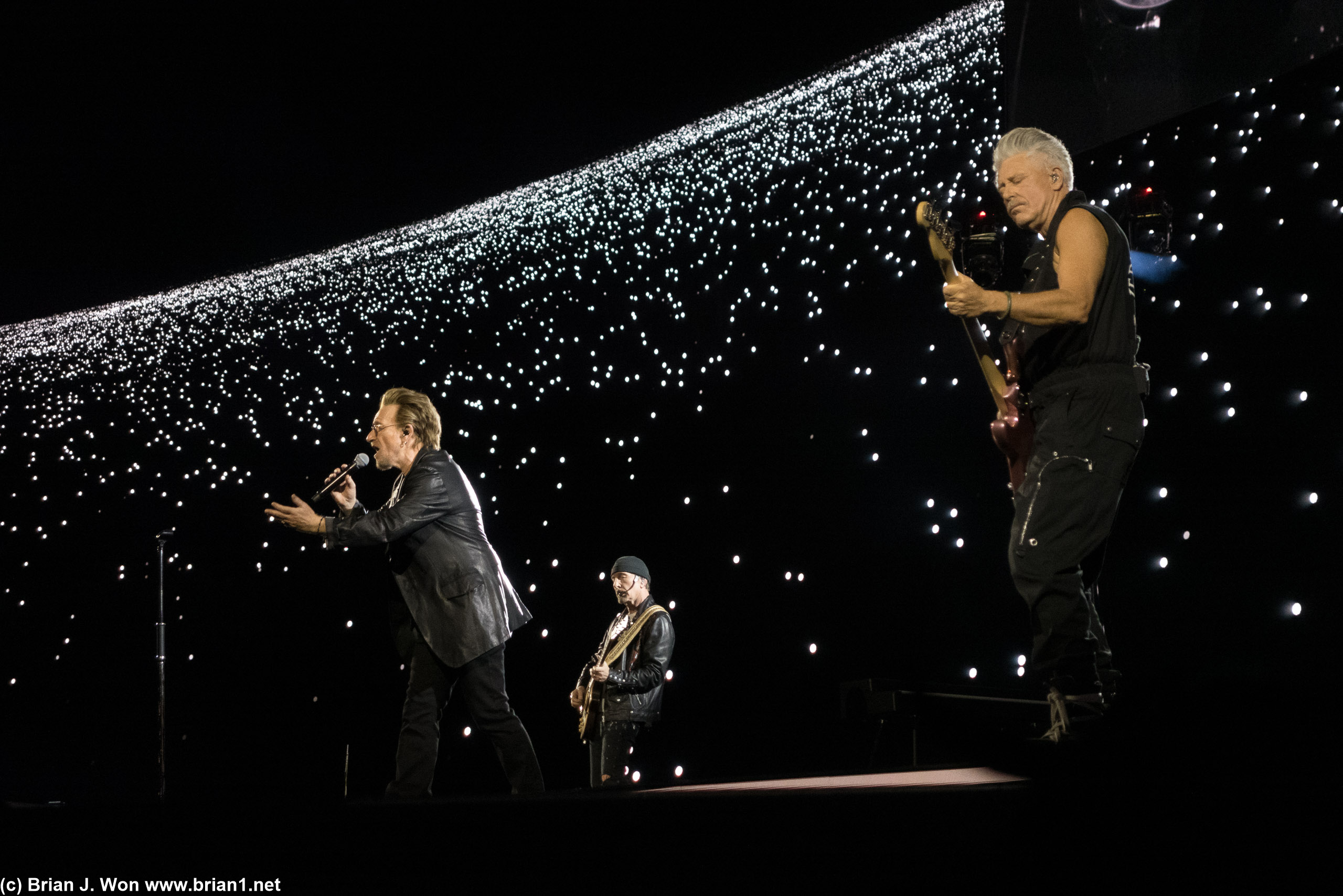 Bono, The Edge, and Adam.