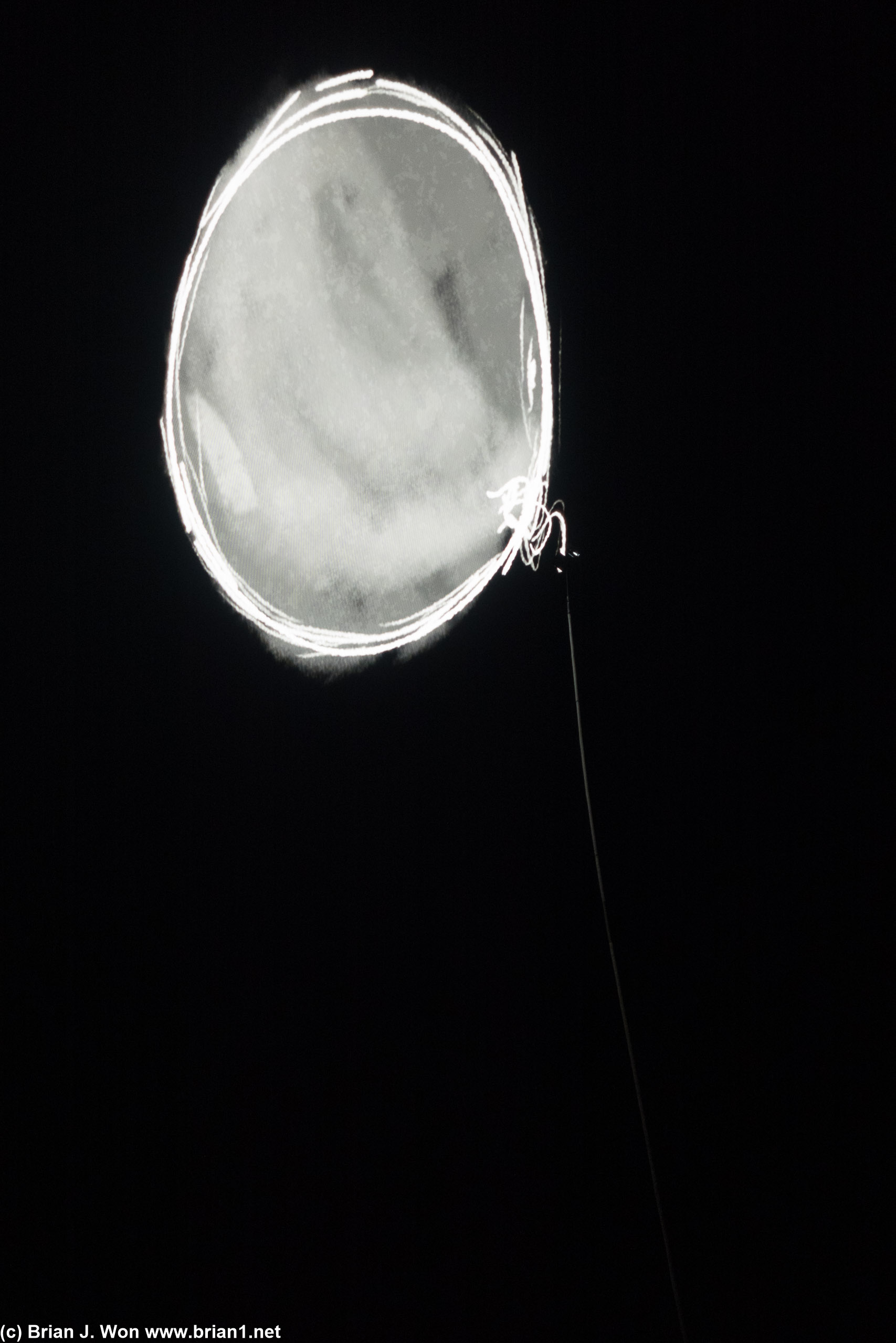 Balloon on screen with an actual rope dangling down.