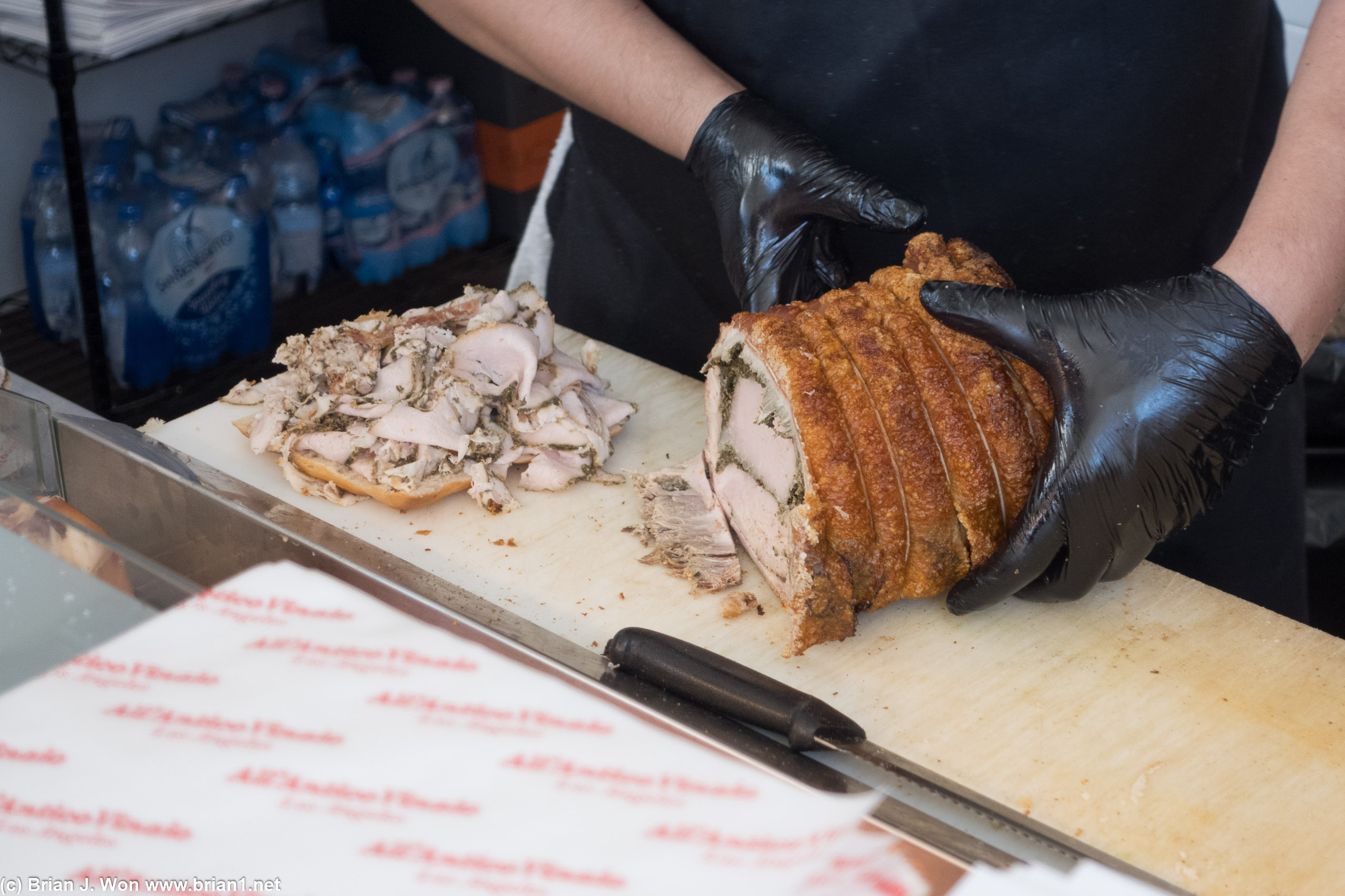 Slicing porchetta.