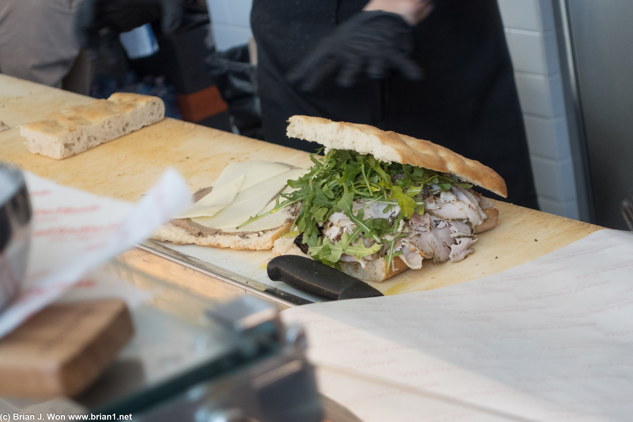 L'inferno almost finished. Porchetta, nduja (spreadable pork sausage), grilled veggies, arugula.