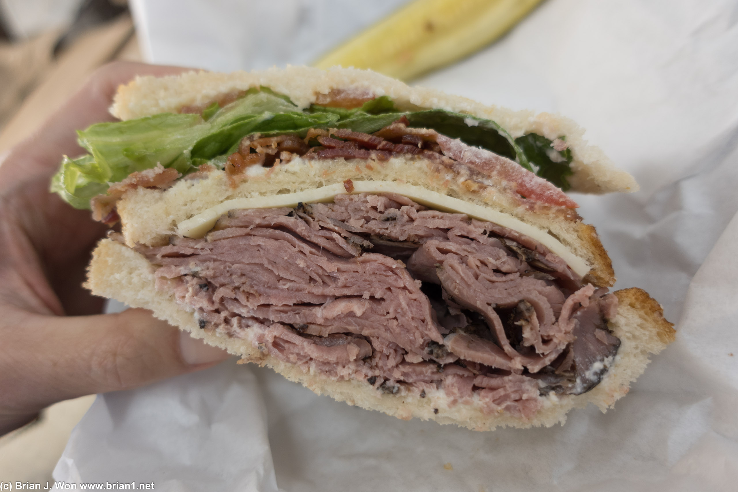 The cut side reveals the true majesty of The Rodeo. Roast beef and smoked bacon with pepper jack, lettuce, tomato.