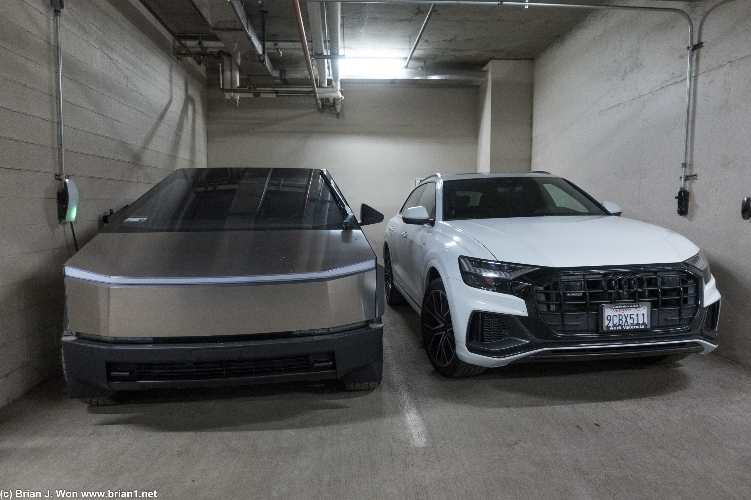 Tesla Cybertruck next to a 2023 Audi Q8.