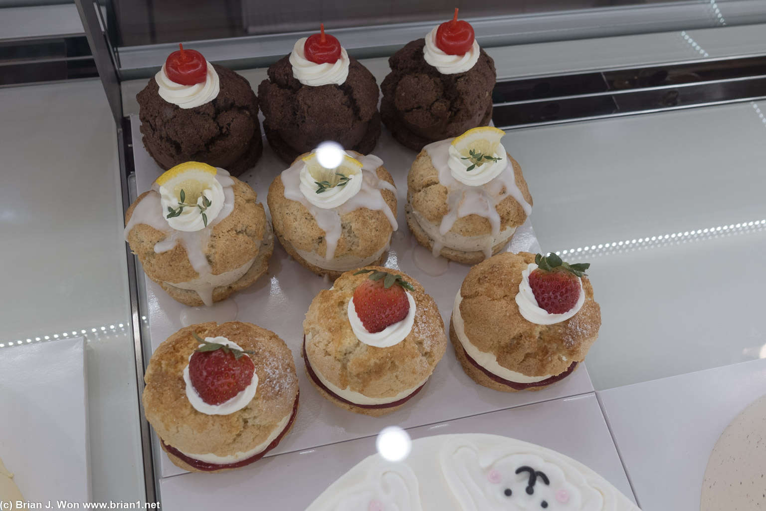 Scones. Strawberry, chocolate, not sure what the other one?