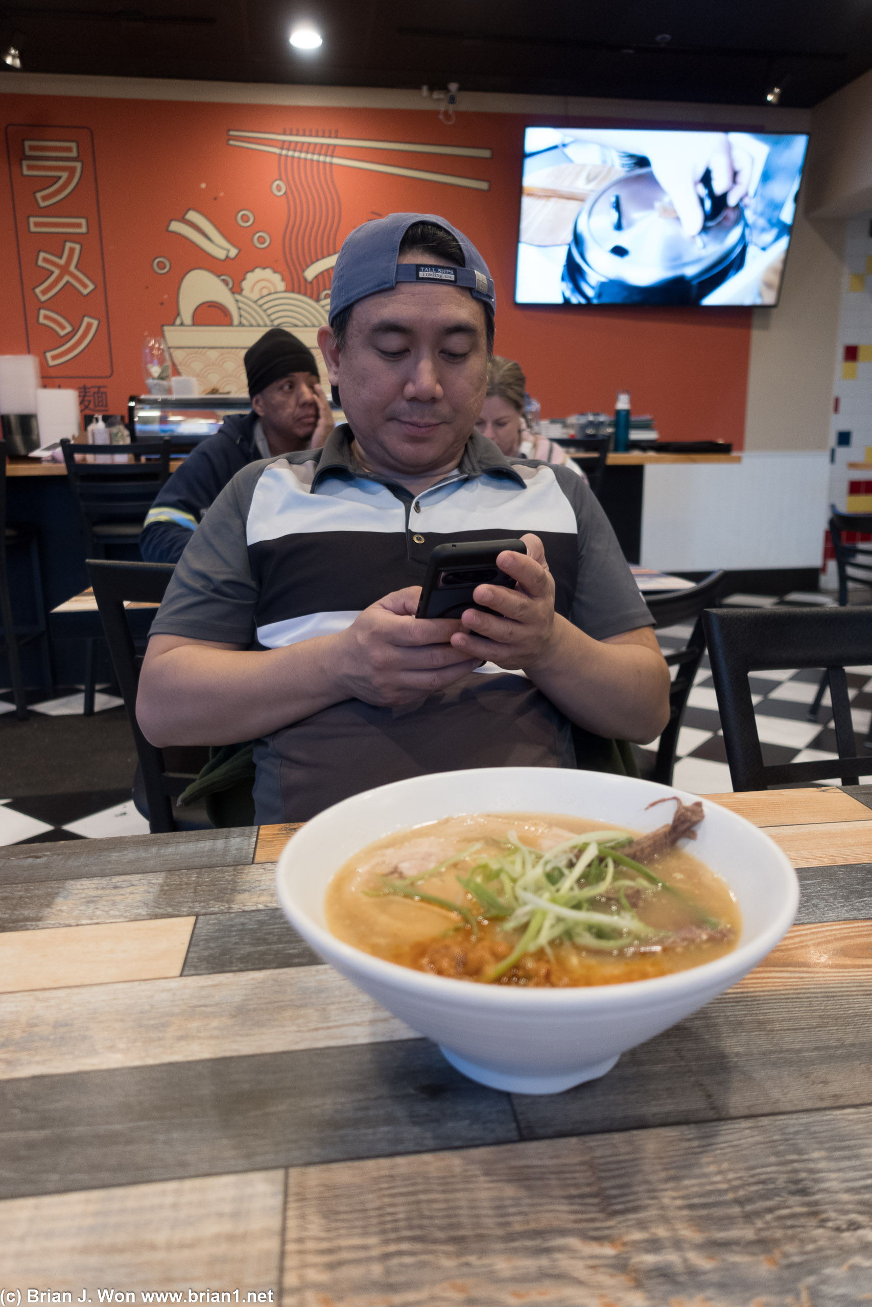 Chris photographing his food.