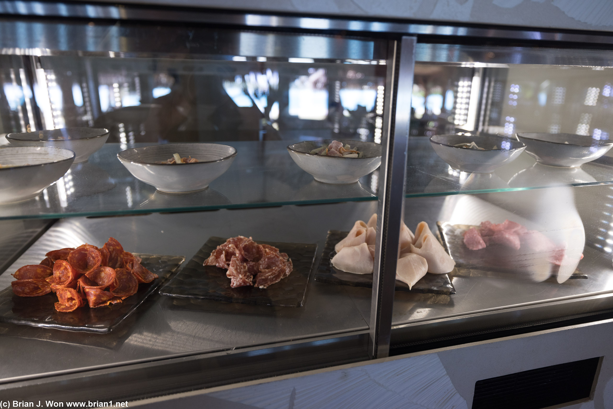 Cured meats below, traditional raw fish above.