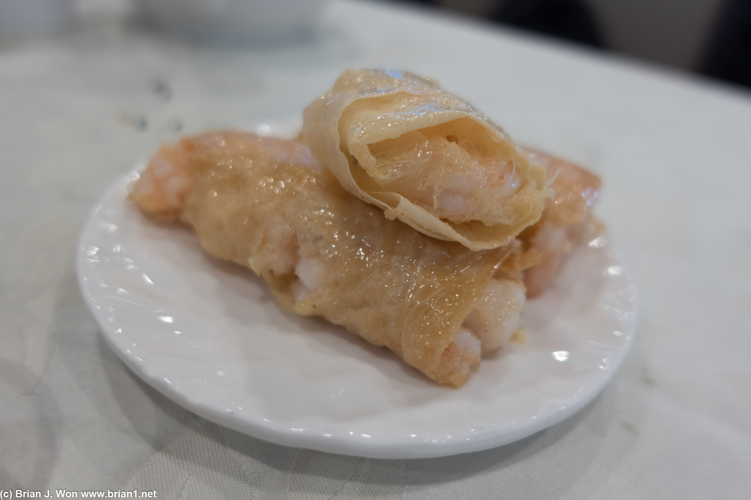 No idea what this is called. Shrimp wrapped something, served with a bit of red wine vinegar.