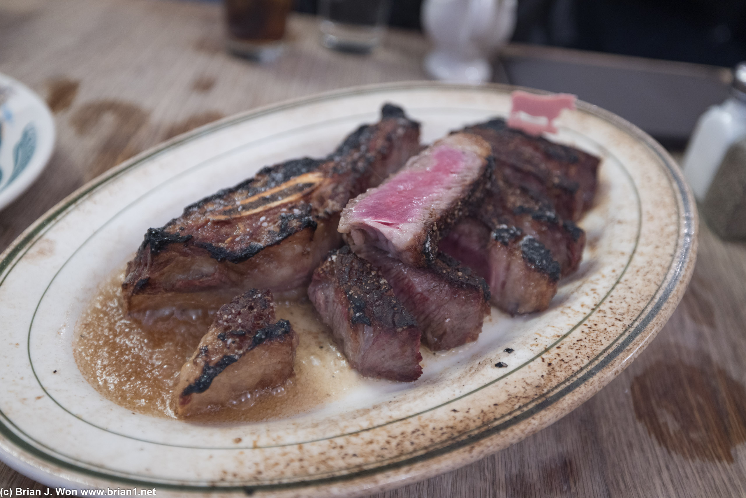 Rib steak, medium rare. Served on an extremely hot plate.