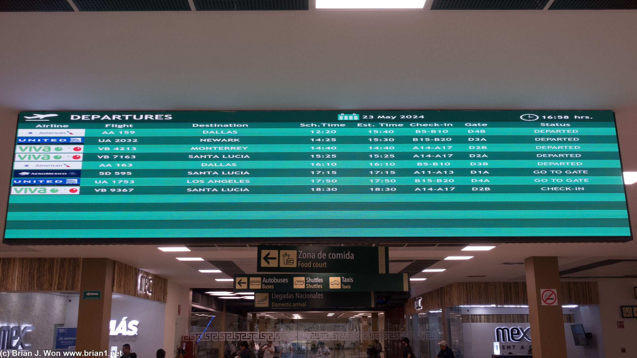 Arrivals and departures board. UA 1753, TQO-LAX, departing in just over an hour.