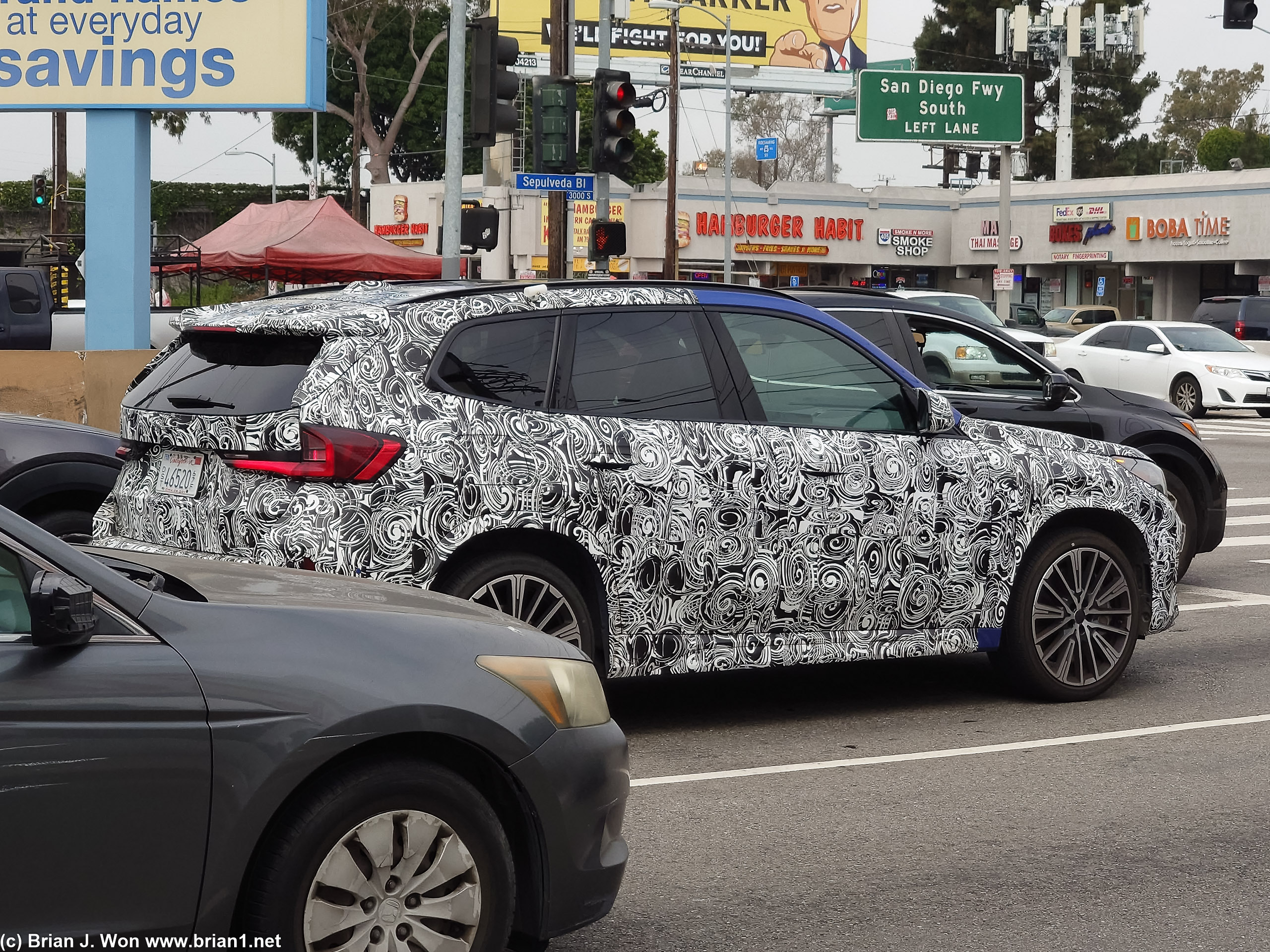 Didn't get a good look at the bumper but wondering why this BMW X1 is so camo'ed... maybe a X1 M or something?