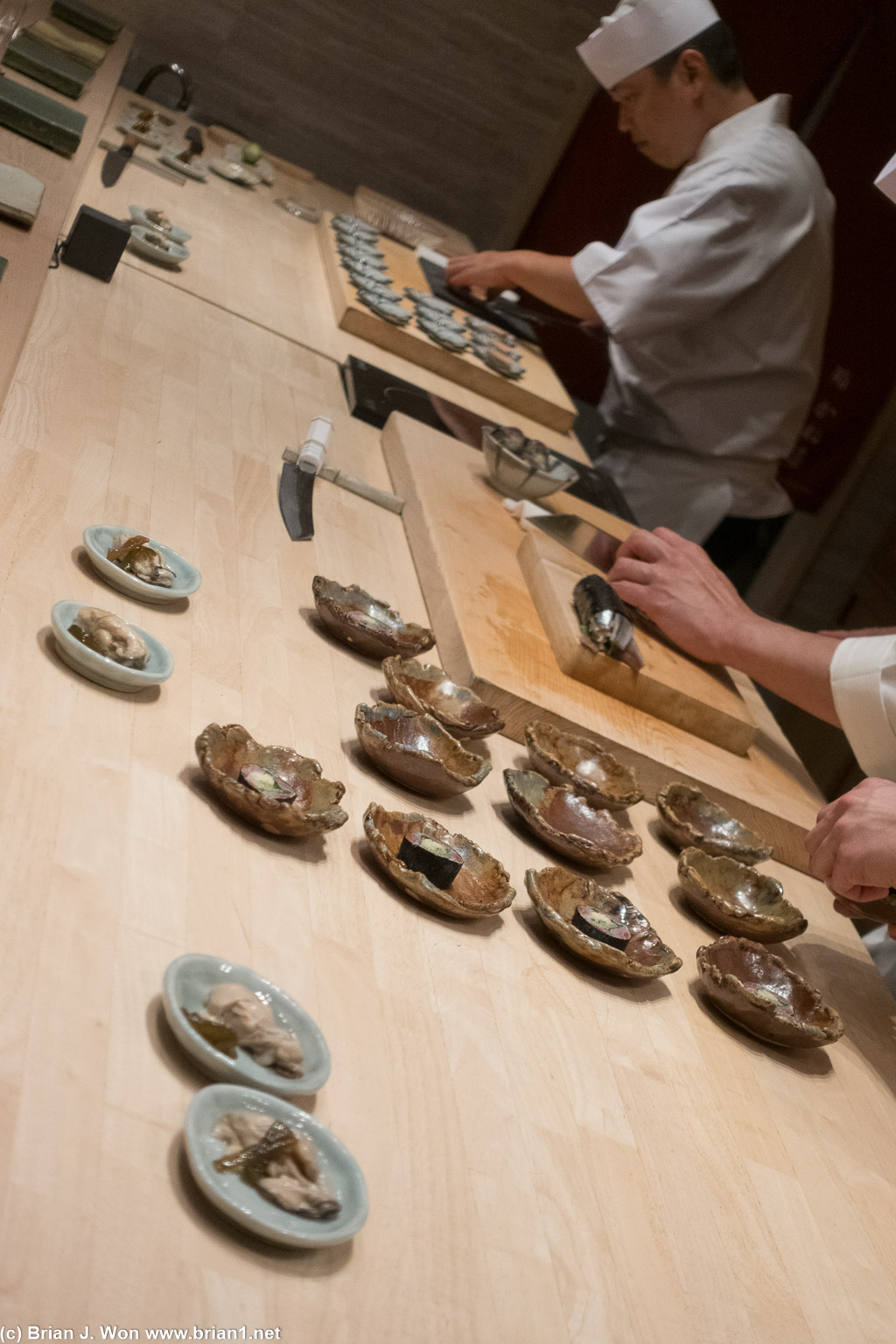 Iwashi maki (sardine) along with oysters (foreground).