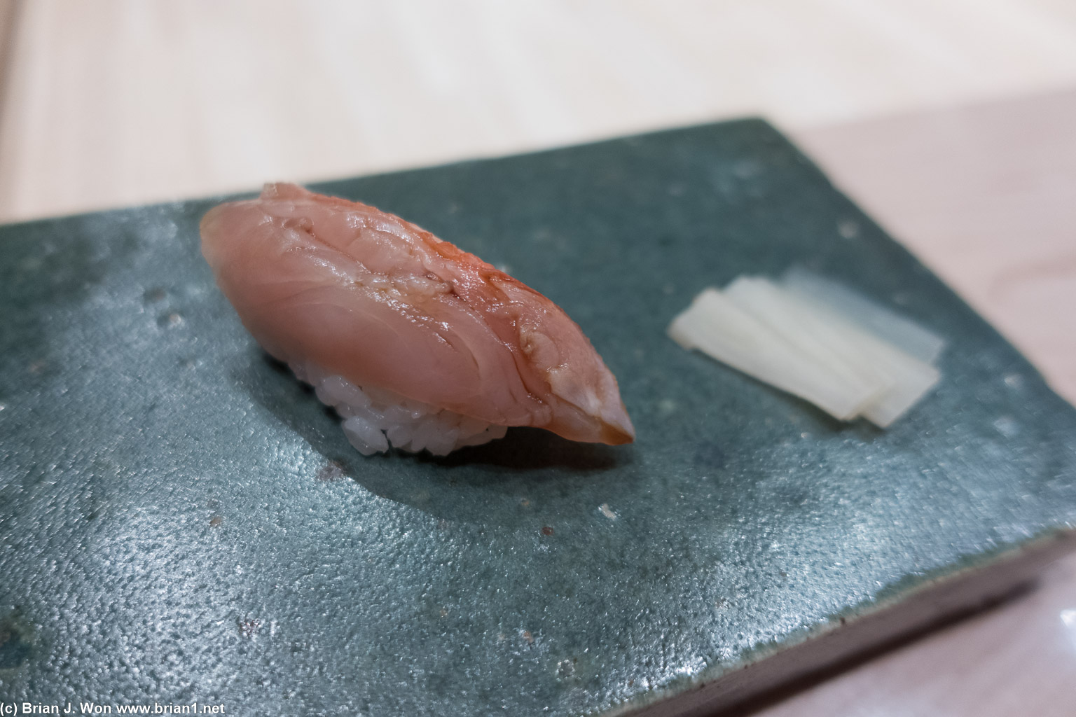 Opening the nigiri course with kinmedia (golden eye snapper).