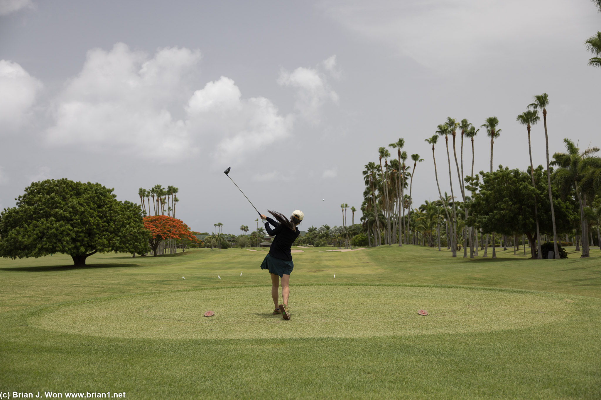 Showing off her golf skills.