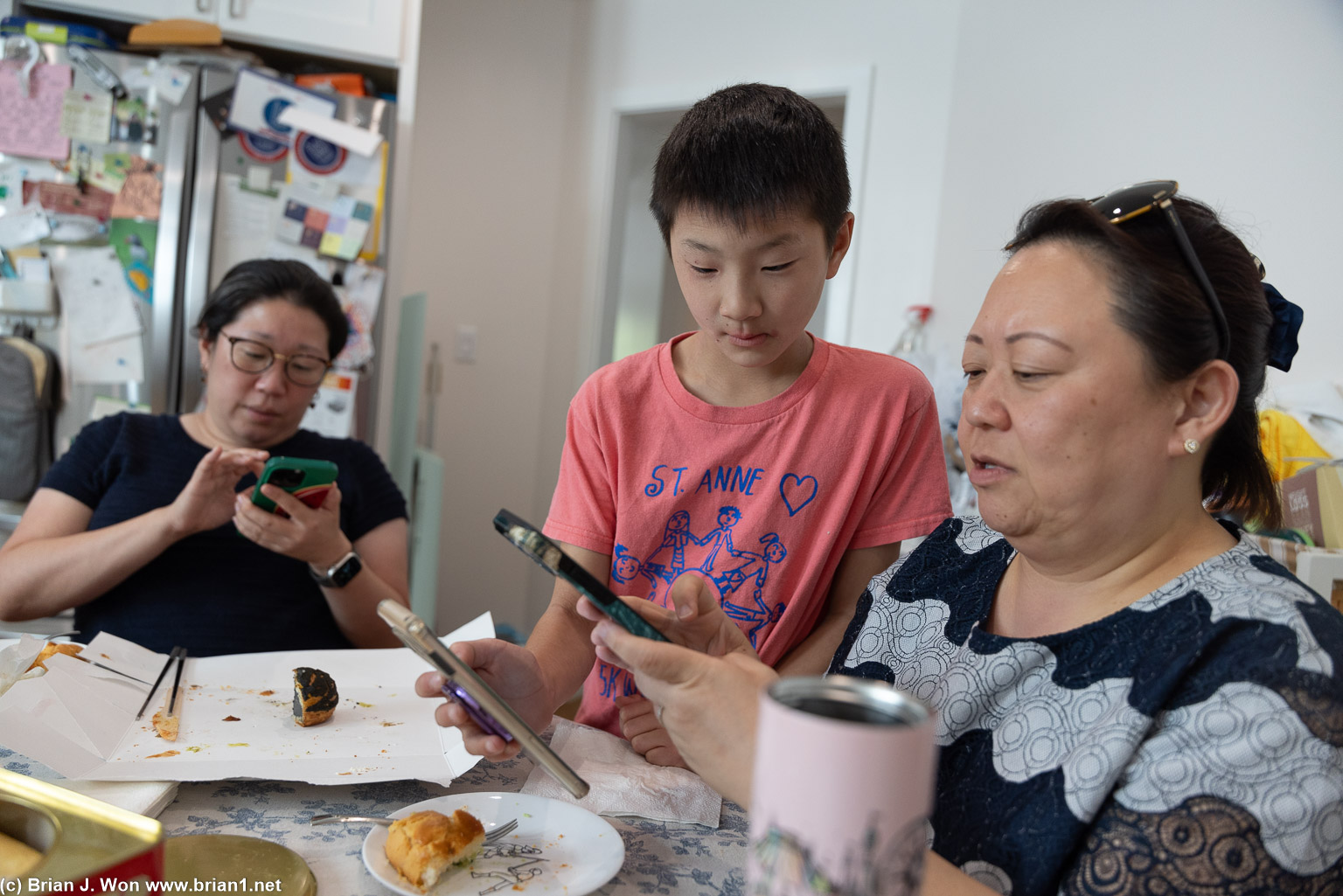 Mason instructing his aunties on Pokemon Go.