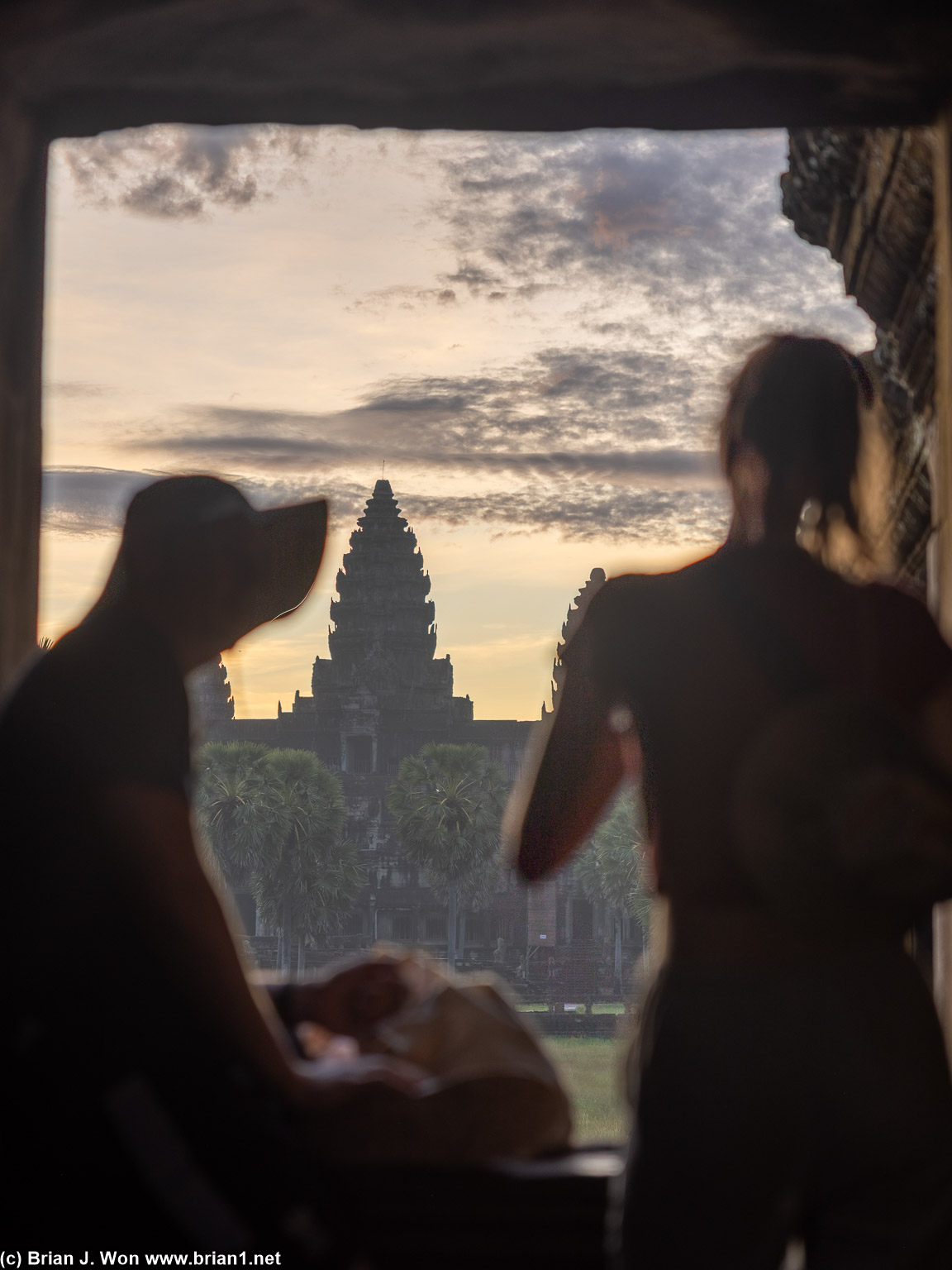 Tourists soaking in the sunrise.