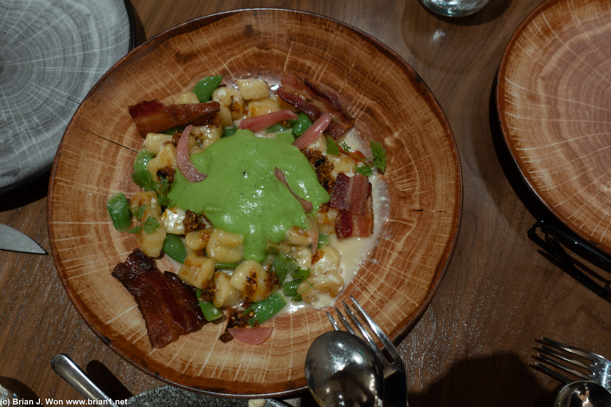 Gnocchi with bacon, onion, pea espuma.