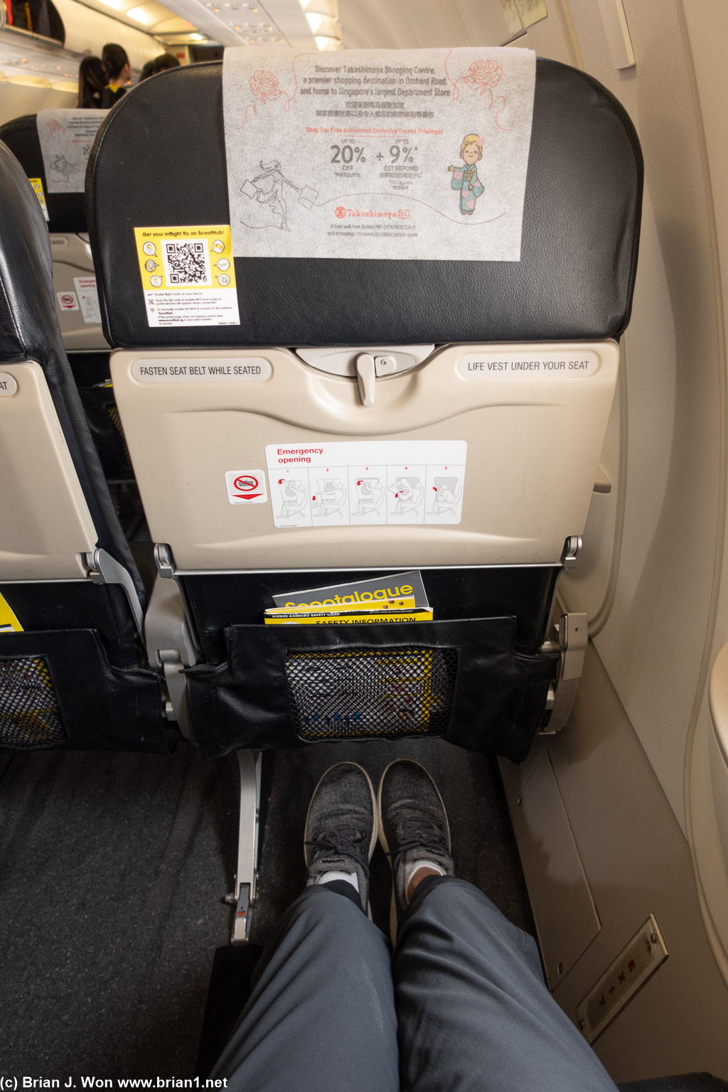 Exit row, about US$20 more, but way more leg room.