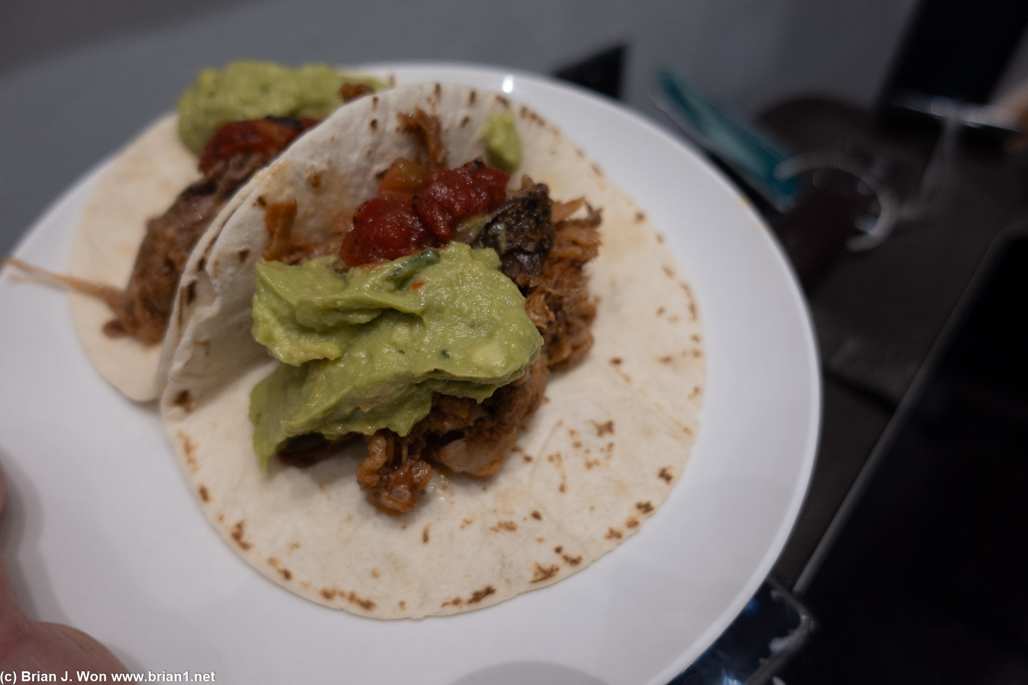 Pulled pork tacos at the United Club, Terminal C, are... edible.