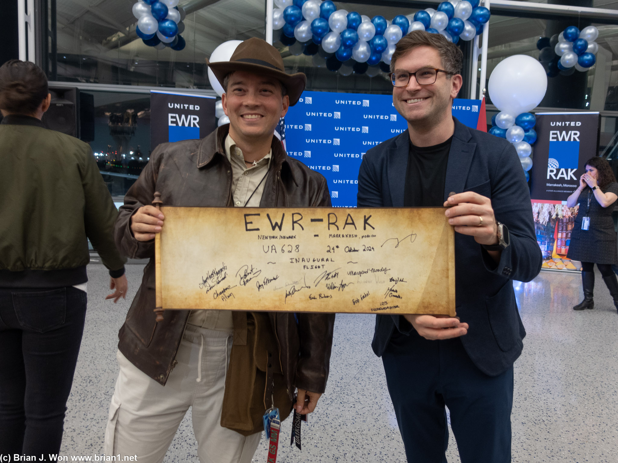 Warren, dressed as Indiana Jones, posing with Zach Honig from Chase.