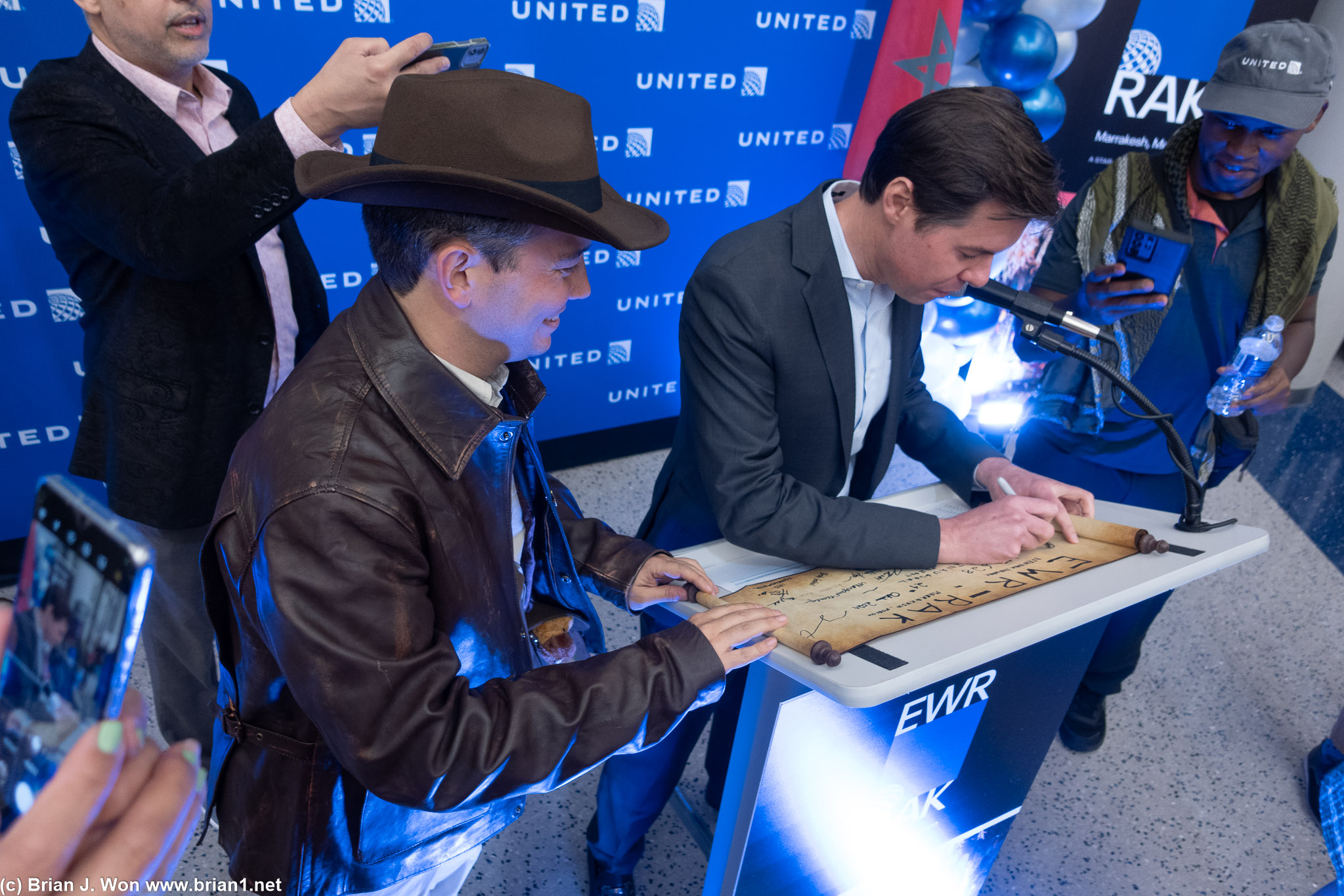 Sr. VP Patrick Quayle signing Warren's scroll.