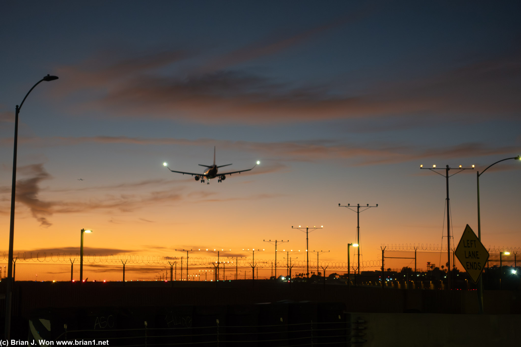 Embraer E175 coming in for a sunset landing.