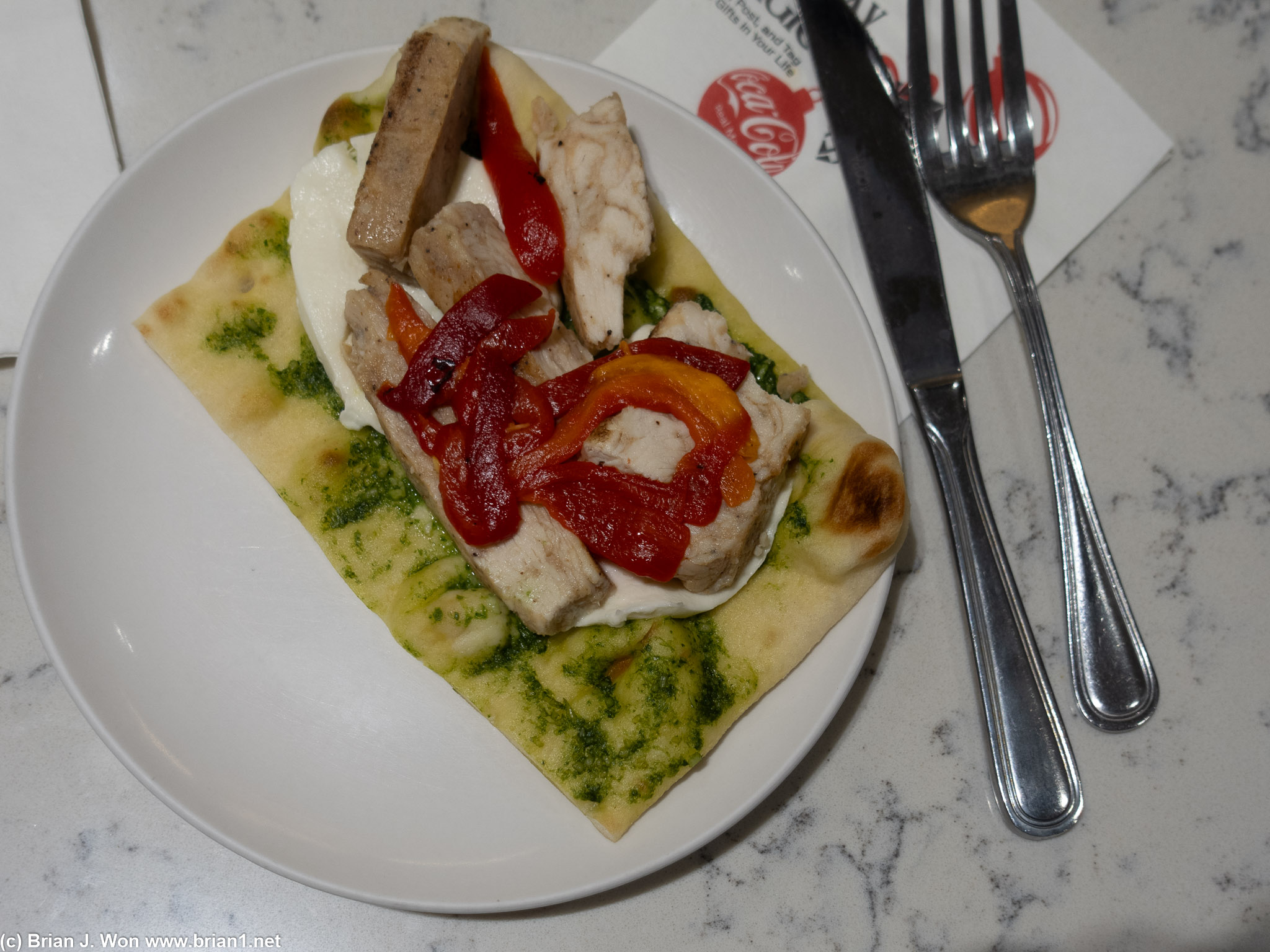 Chicken, cheese, pesto flatbread at United Club was not bad.