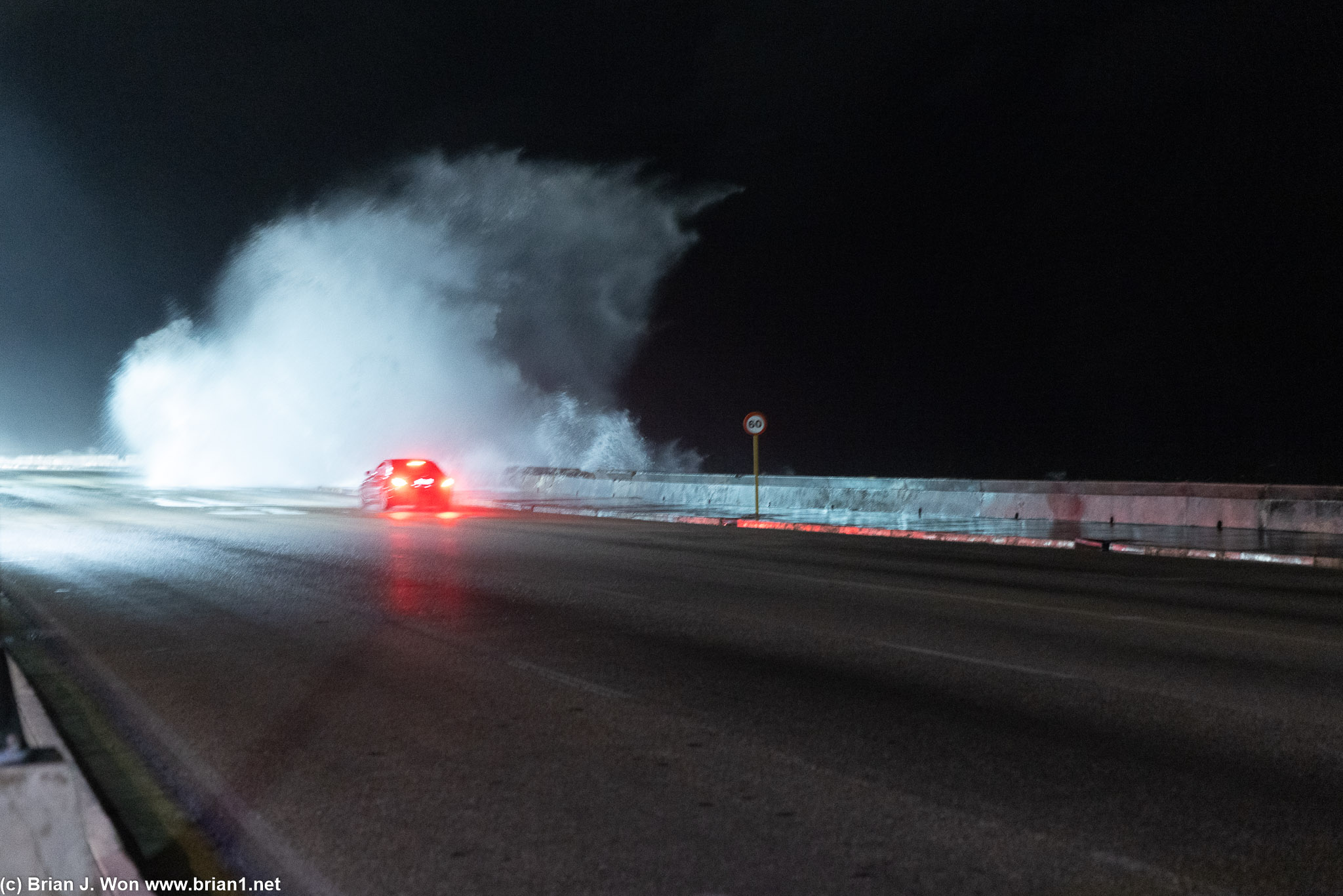 The northern coast road is often swamped by waves.