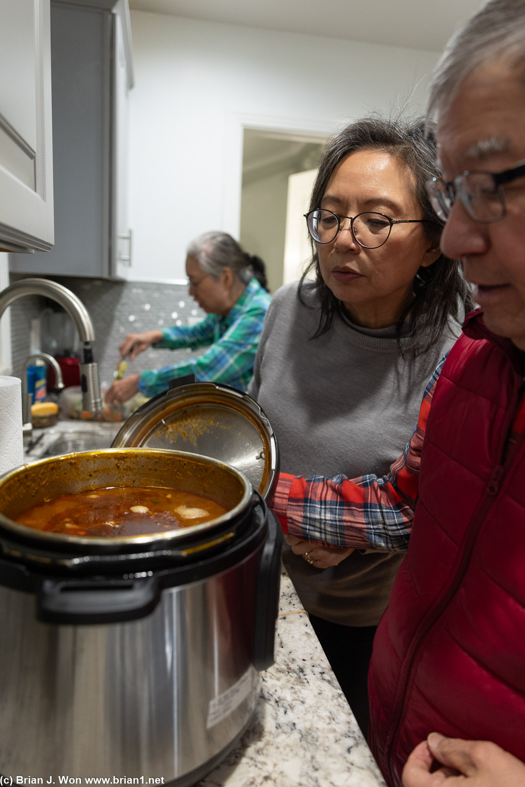 Aunt Pattey looking at Dad's bean soup.