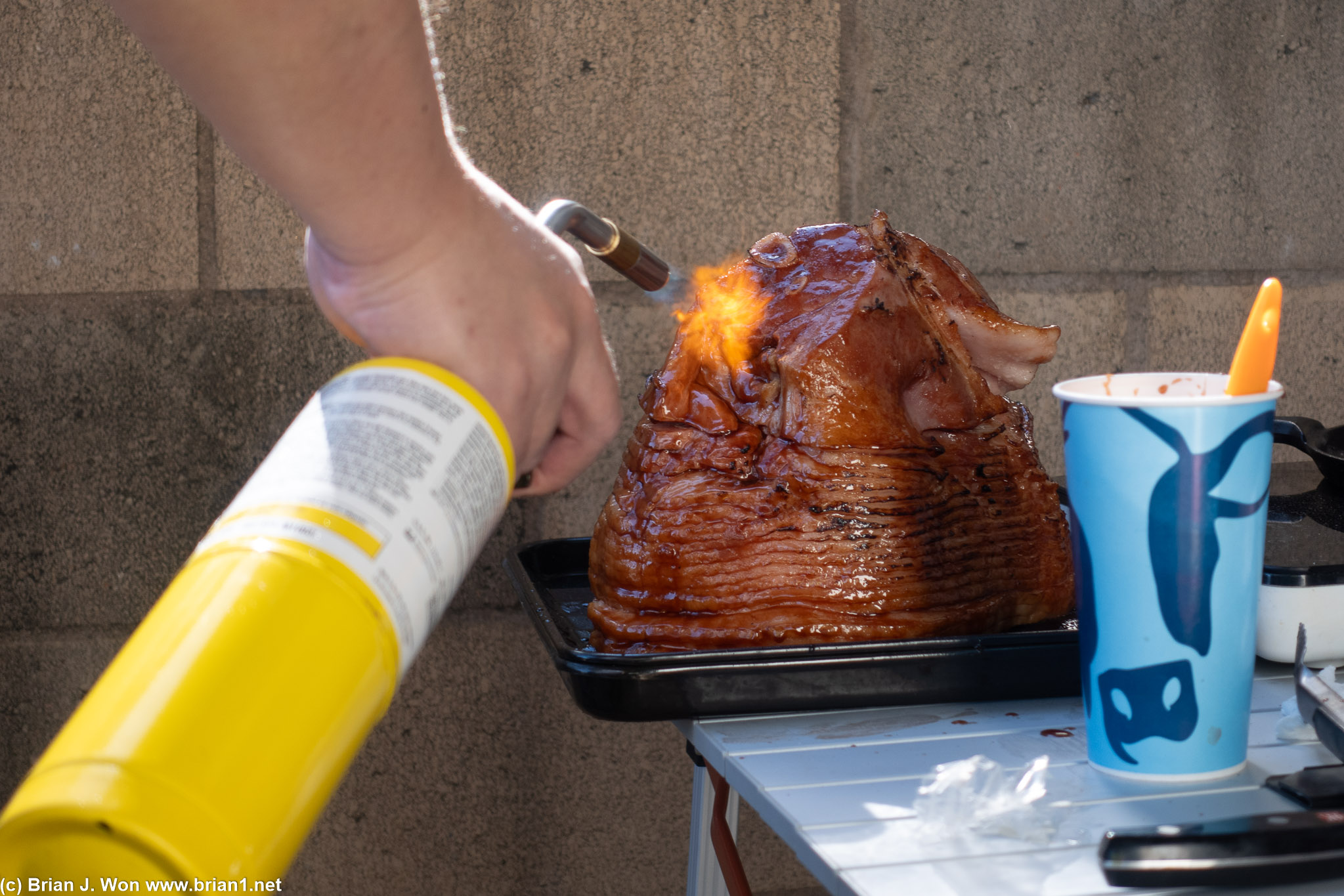 Joe blow-torching the glaze on his ham.