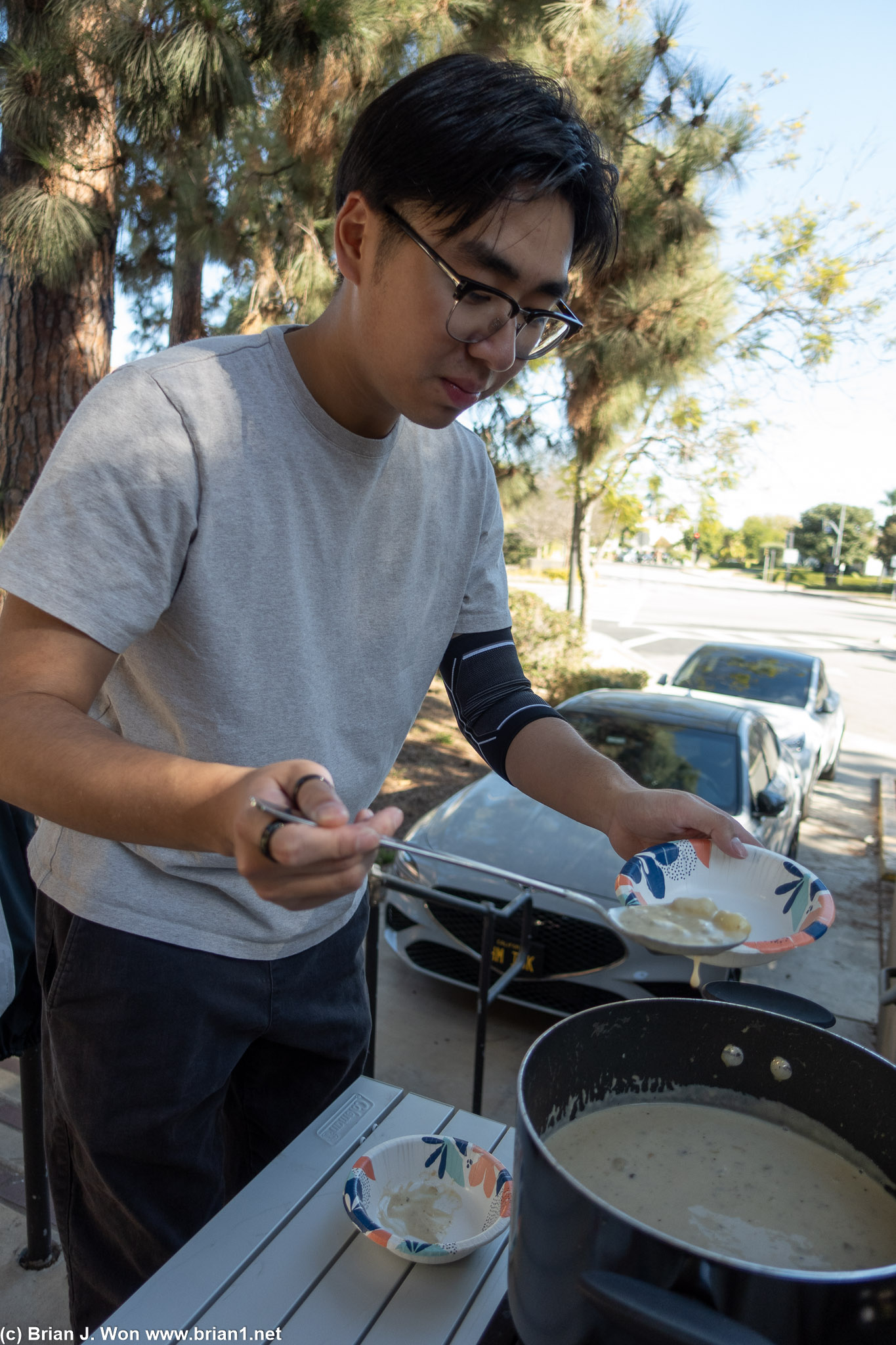 Jason ladling out Kennet's clam chowder.