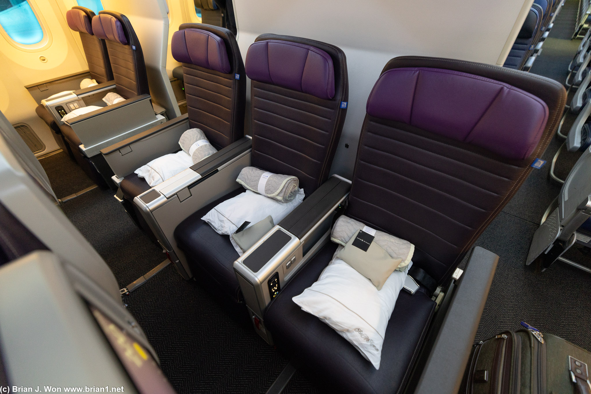 Premium Plus (premium economy) middle seat the next 17+ hours.