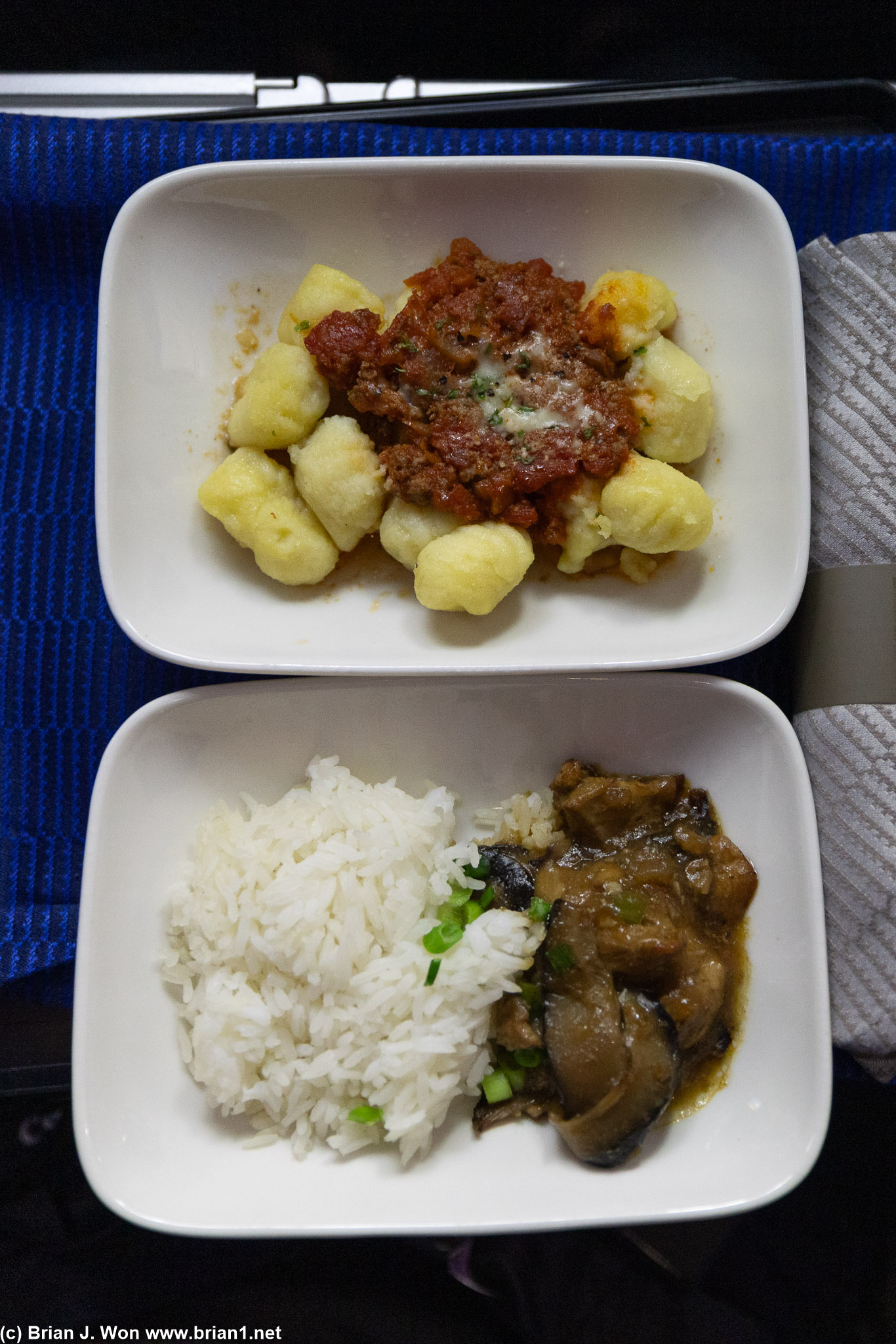 Flight crew took pity on me and sent over some tapas (mid-flight snack) from Polaris. Gnocchi (top) and chicken and rice (bottom).