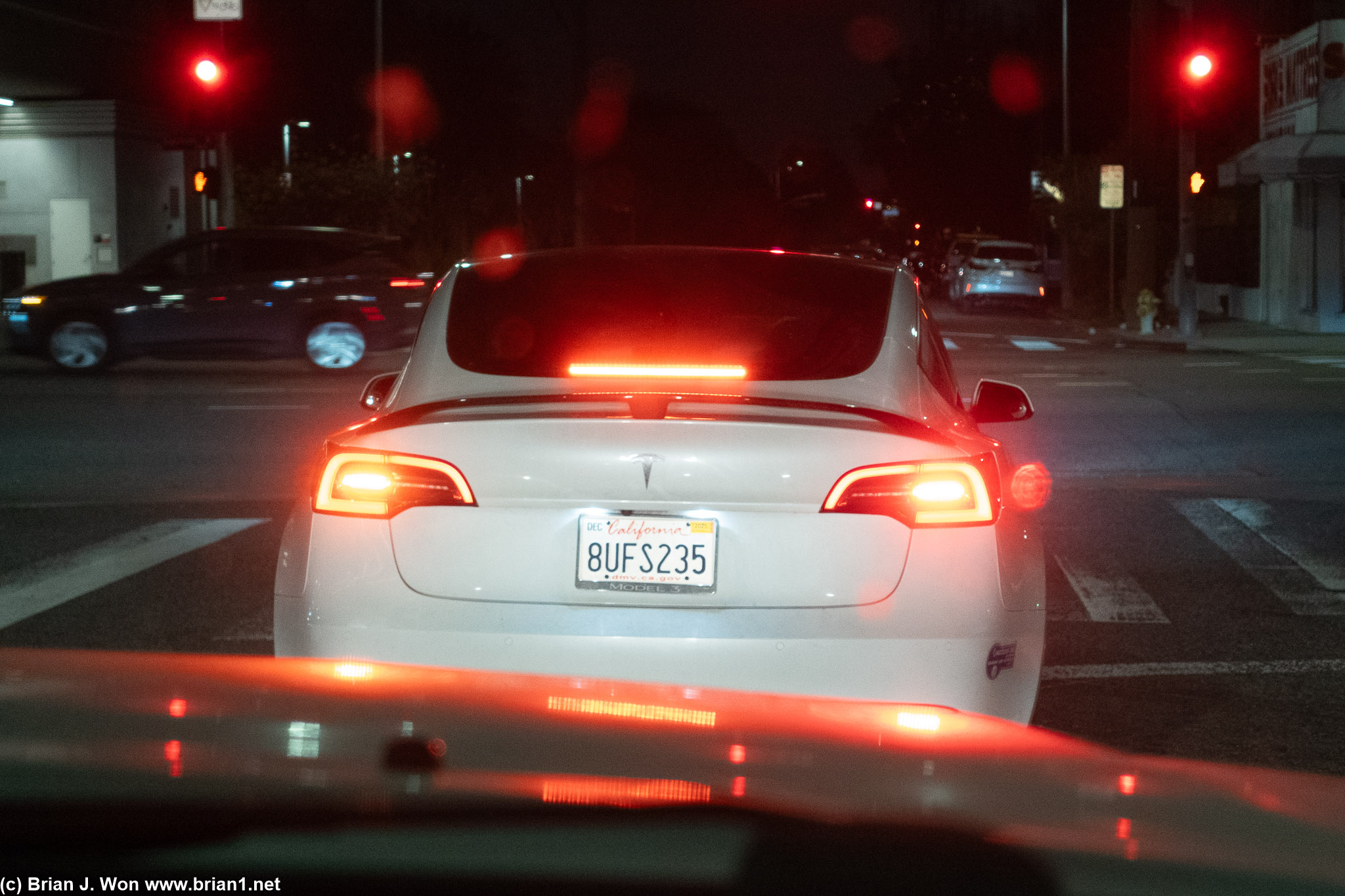 Non-standard spoiler on this Model 3, looks almost like the factory 5th gen Maxima SE spoiler in character.