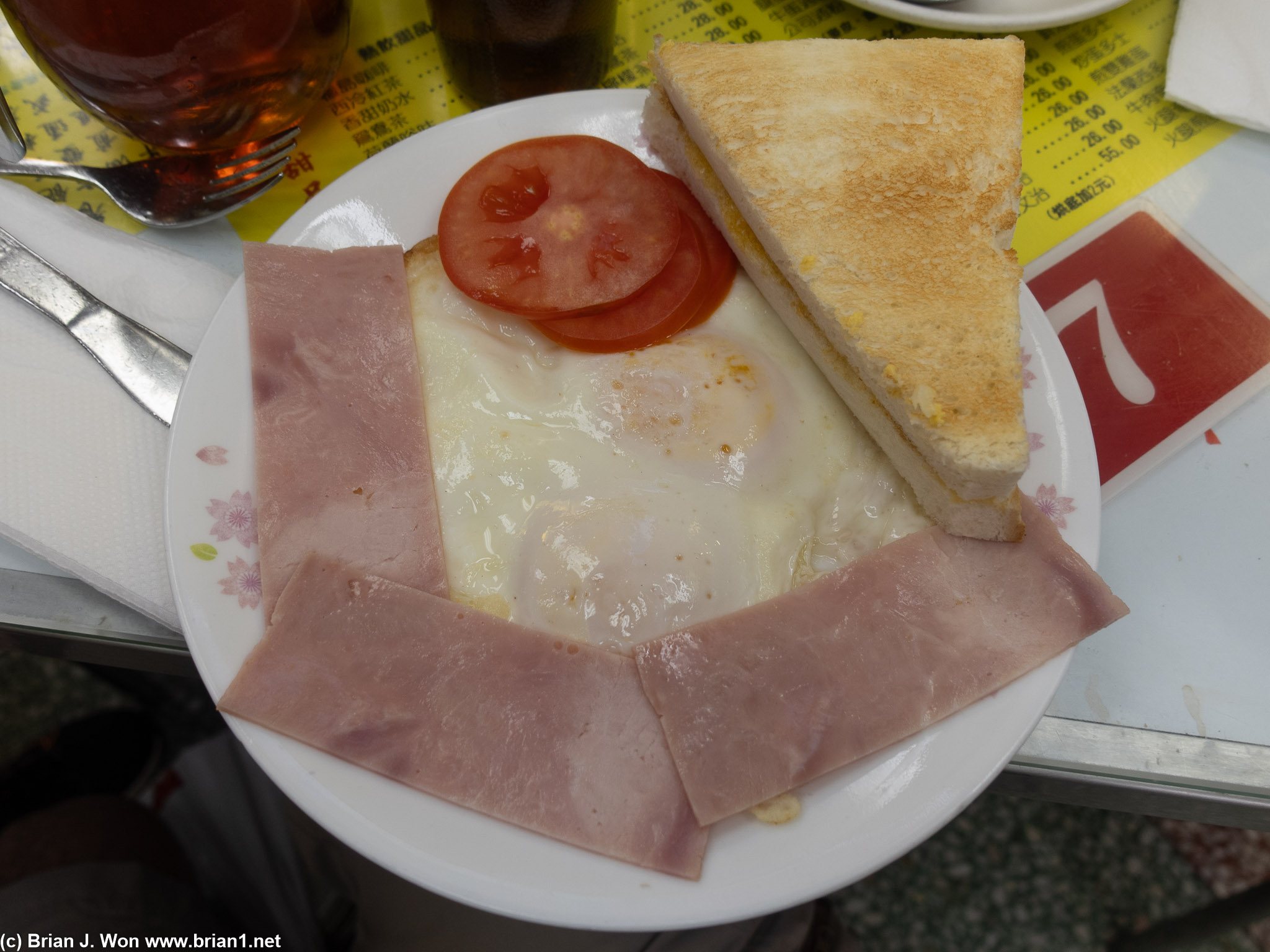 HKD 55 for ham, fried eggs, tomato, toast.