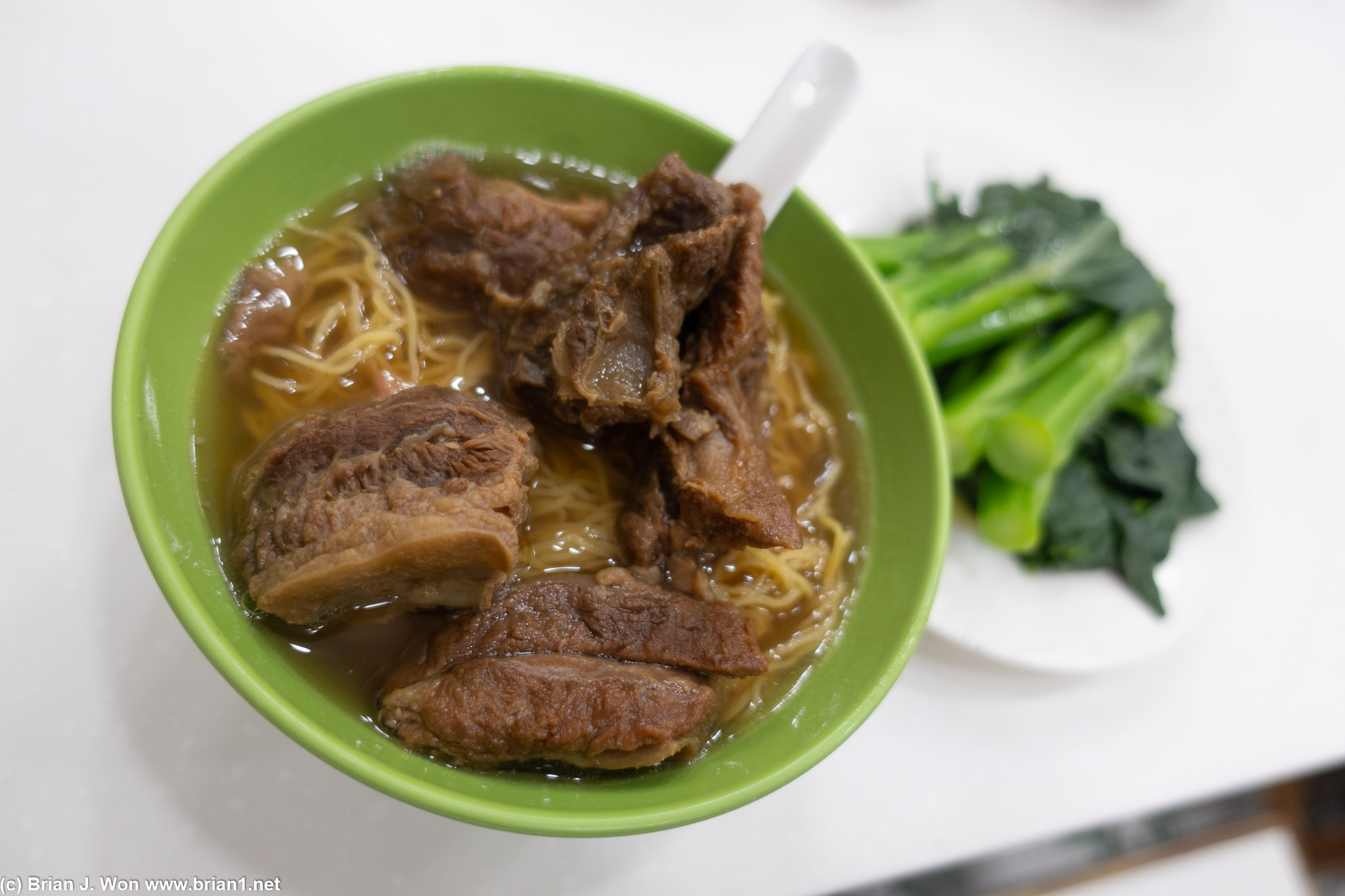 Beef brisket noodle with side of gai lan.