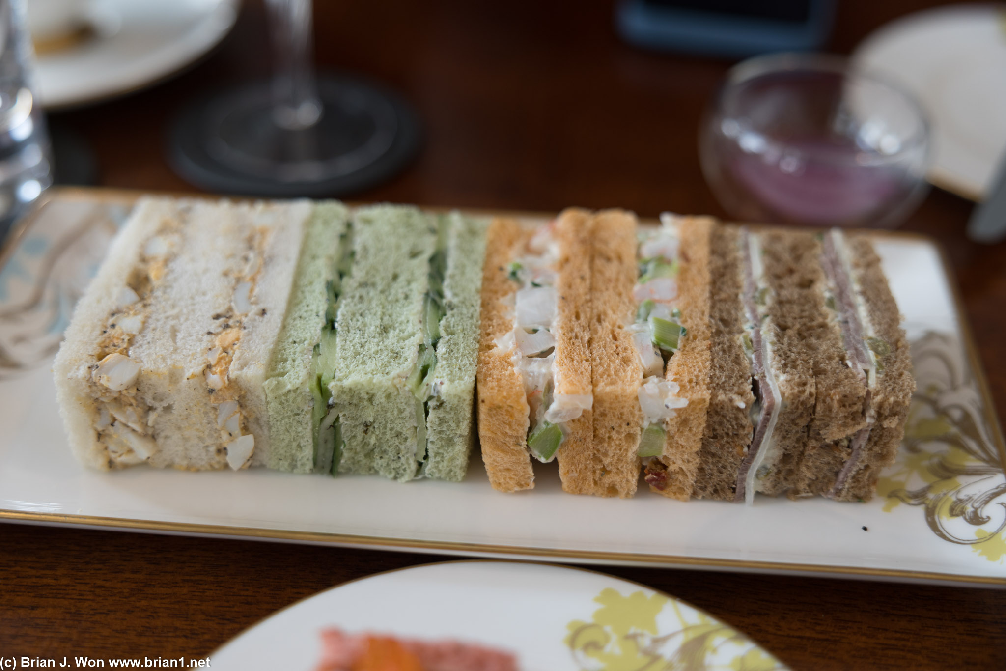 From right: roast beef on malbran bread, prawn/elderflower/asparagus on tomato bread, egg and black truffle, cucumber and herbs on spinach bread.