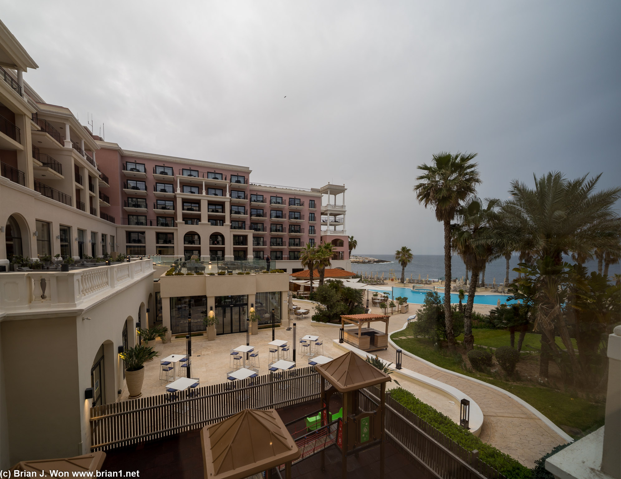 View from the lobby of the Westin Dragonara towards the ocean, and their pool, lobby patio, etc.