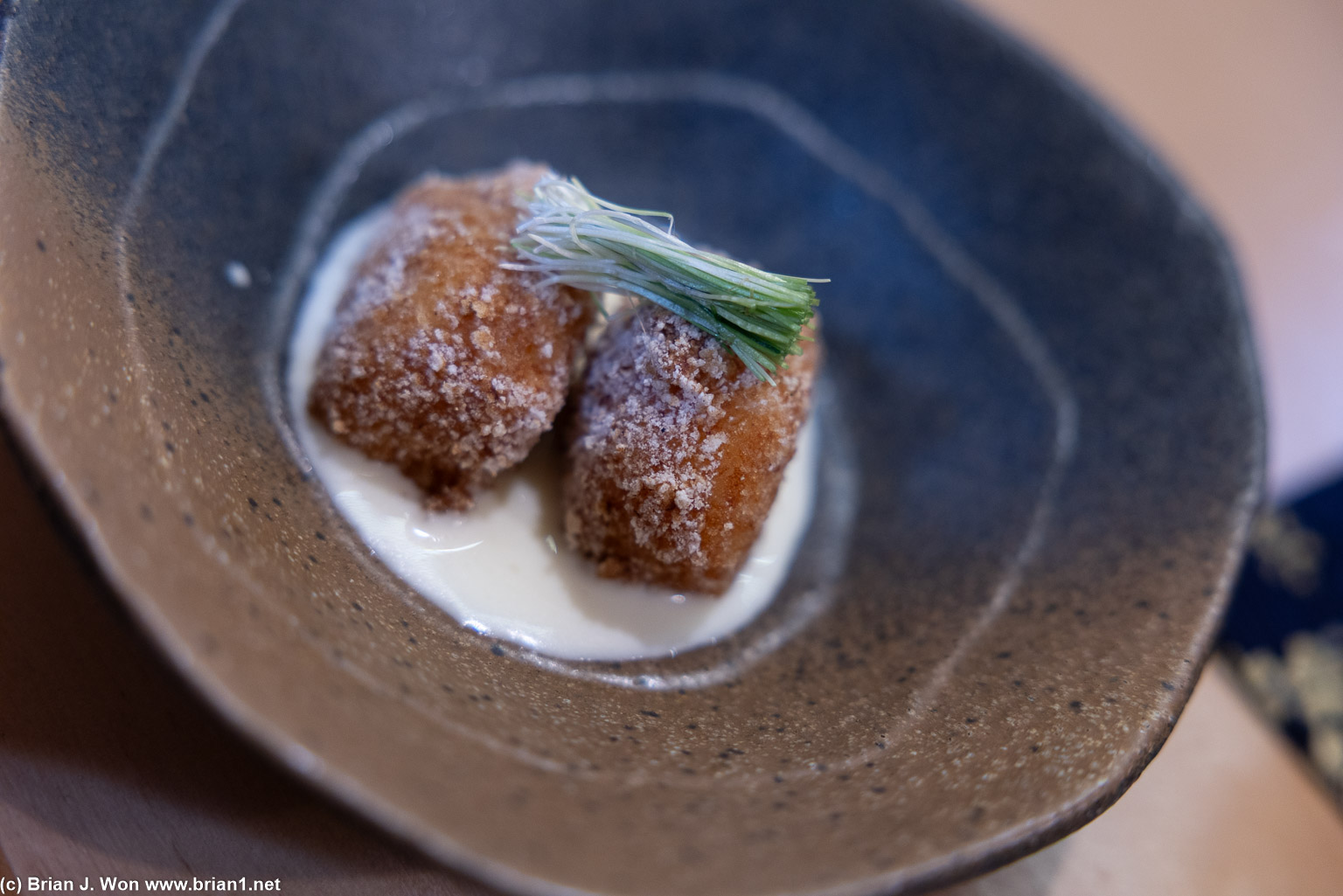 Scallop from Hokkaido, white kogi white ponzu sauce, green onion.