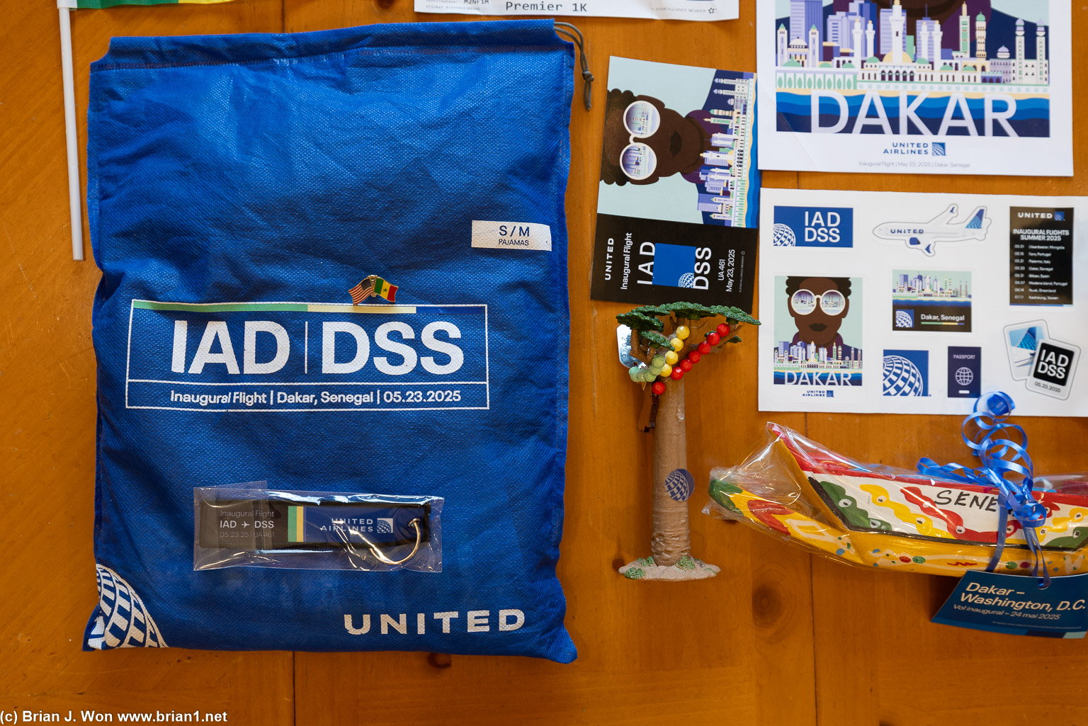 Pajamas, keychain, flag pin, postcard, stickers, boat, tree.