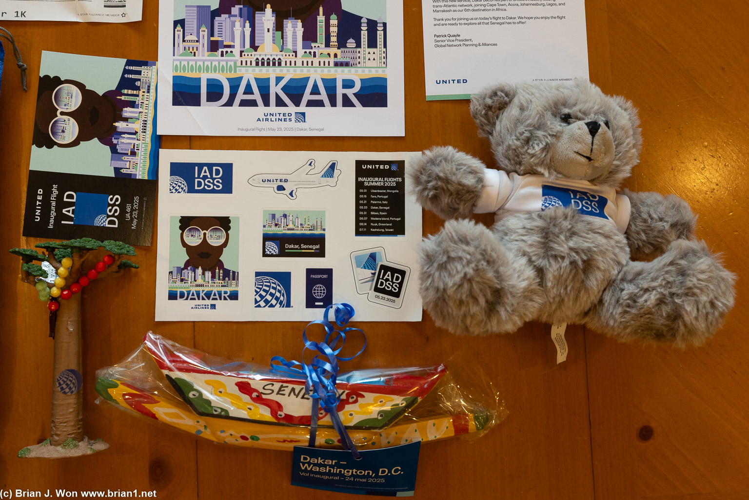 Postcard, tree, boat, stickers, teddy bear.