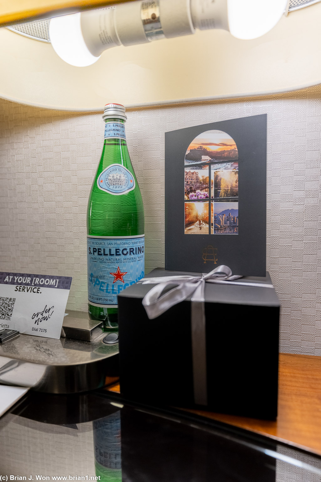 Welcome gift, card, and sparkling water.