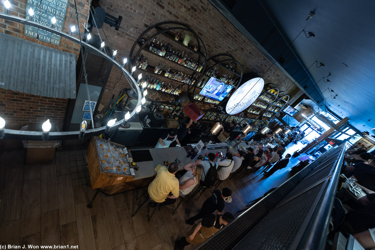 Looking down at the bar.