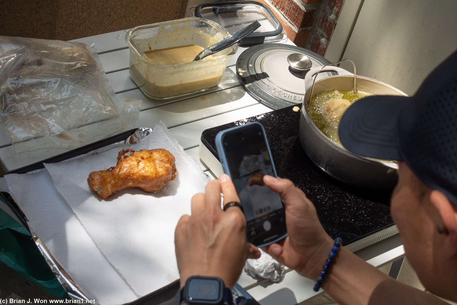 Photographing a photographer photographing his food.