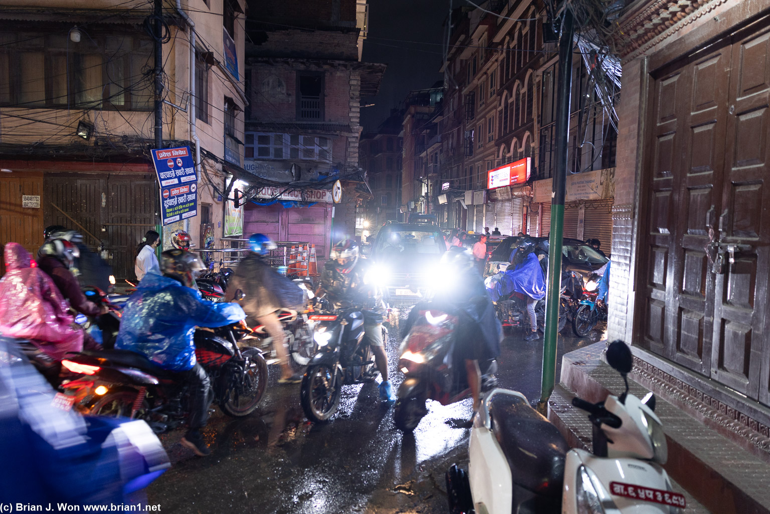 Traffic, narrow streets, and rain.