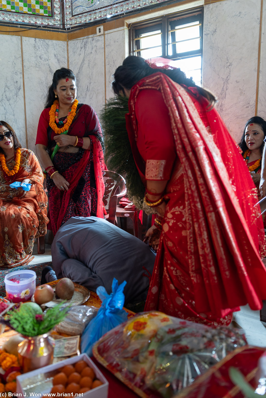 Groom bows to his bride.