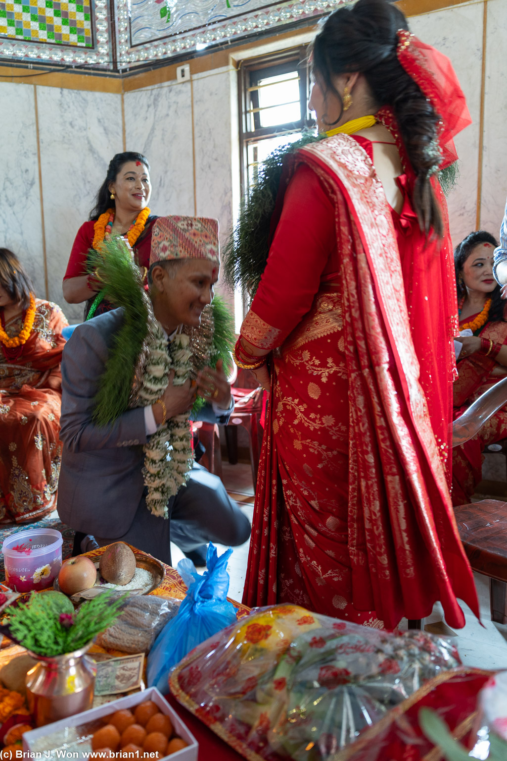 Groom bows to his bride.