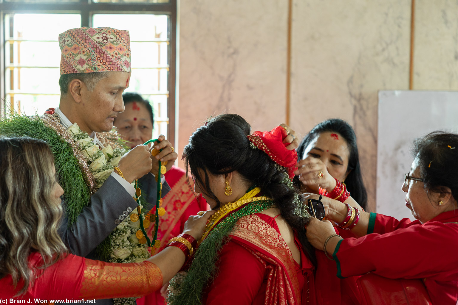 Fussing over the bride.