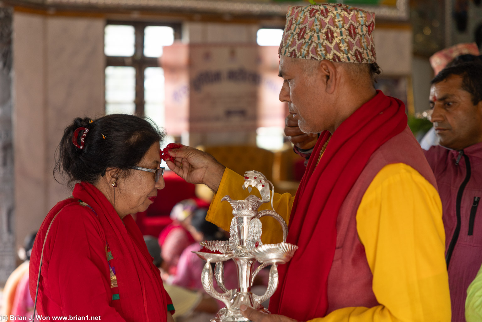 Tika (placing of rice on forehead for blessings).
