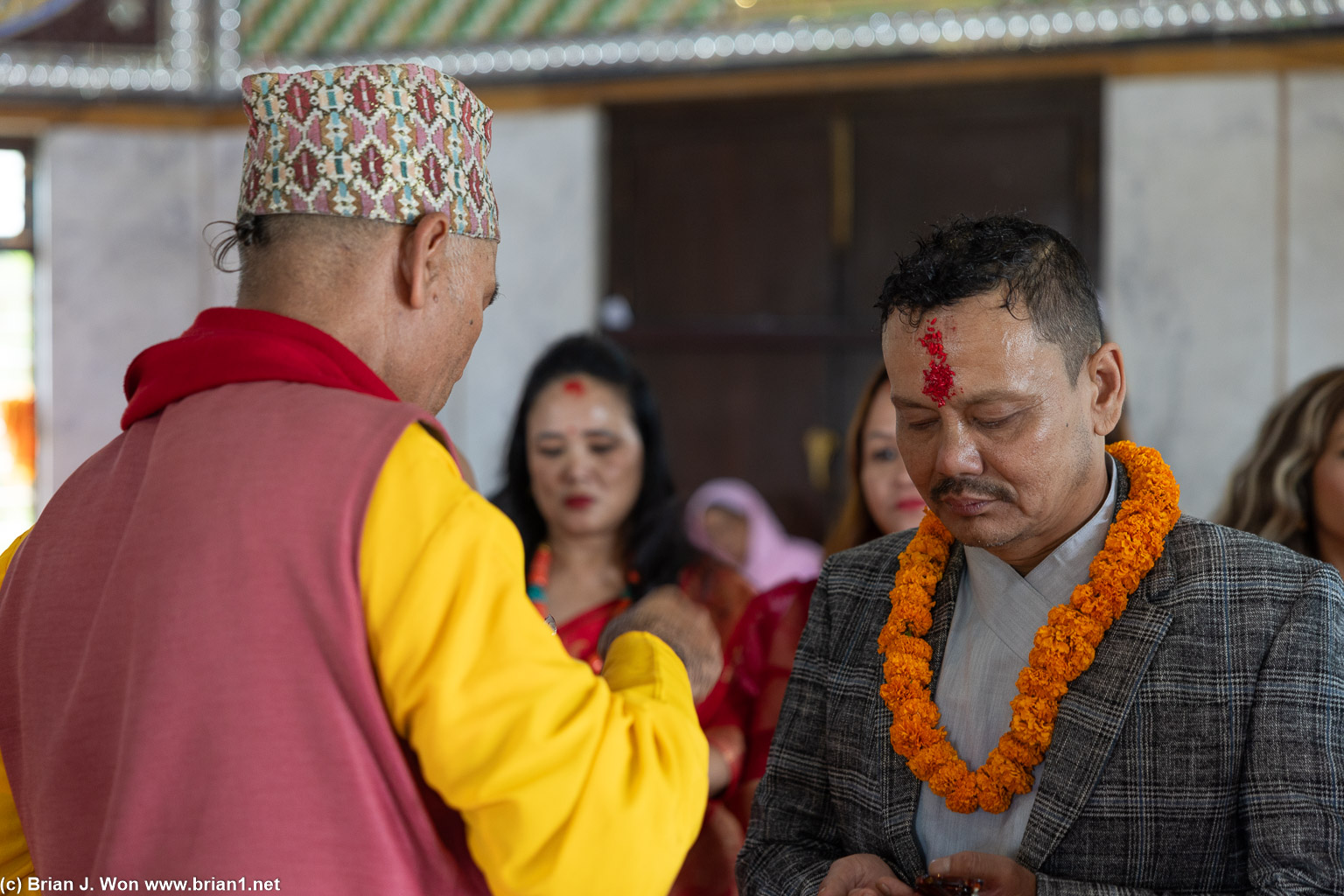 Tika (placing of rice on forehead for blessings).