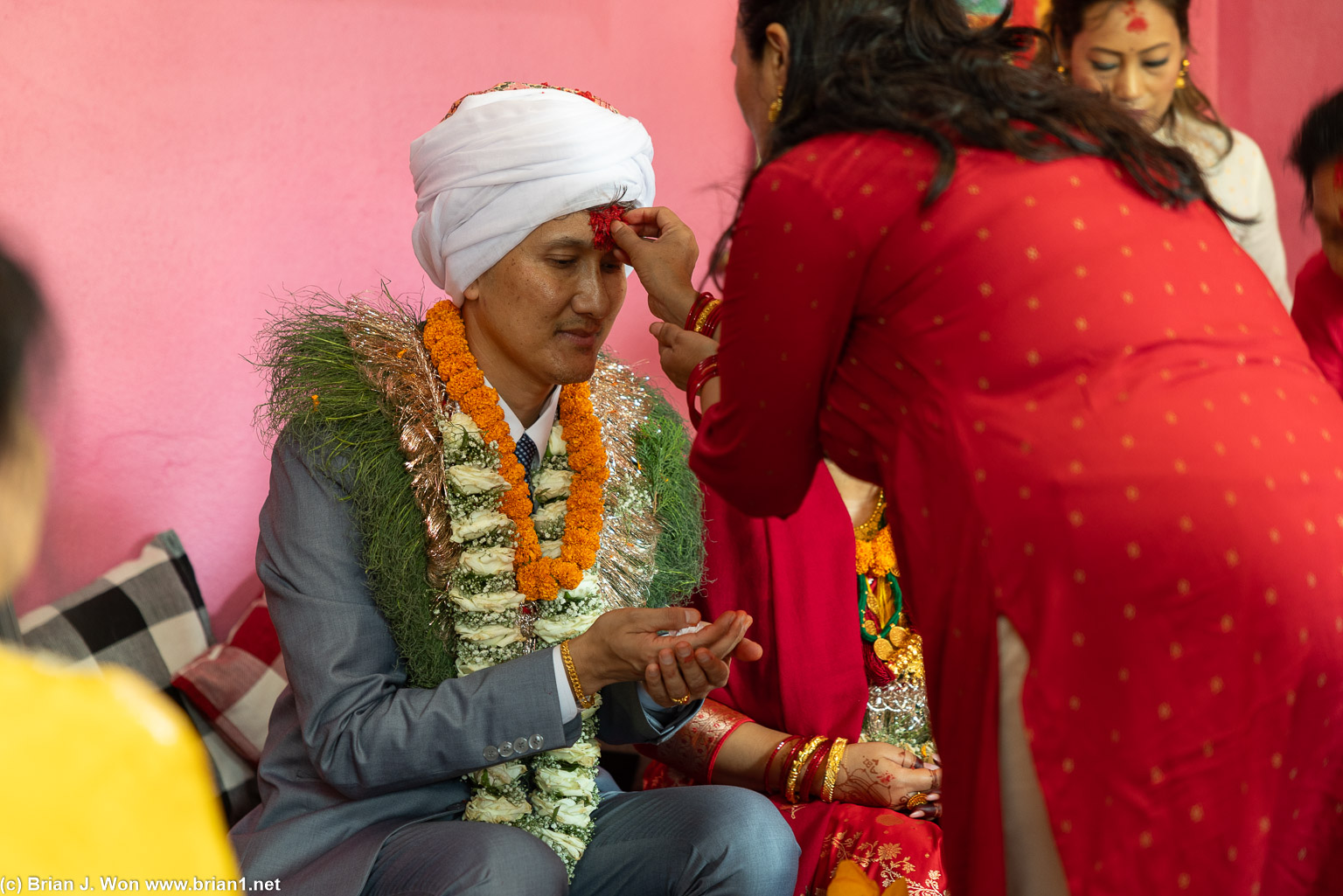 Tika (placing of rice on forehead for blessings).